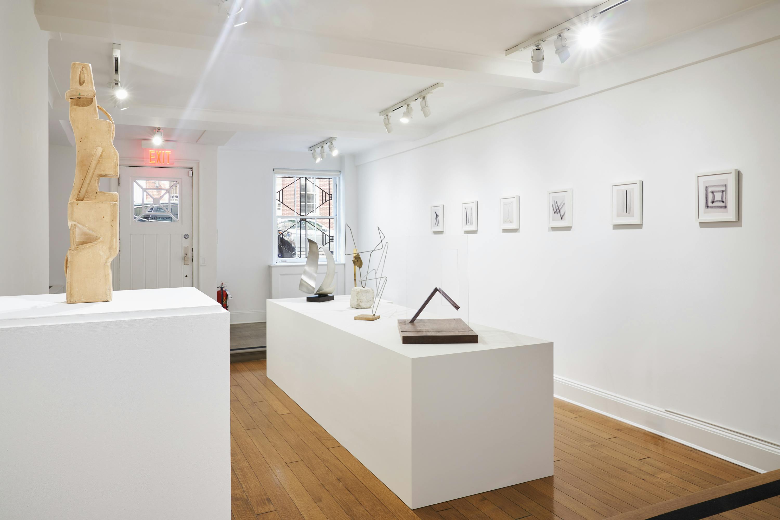Gallery view of From Surface to Space exhibition showing six free-standing sculptures and six wall-mounted drawings.