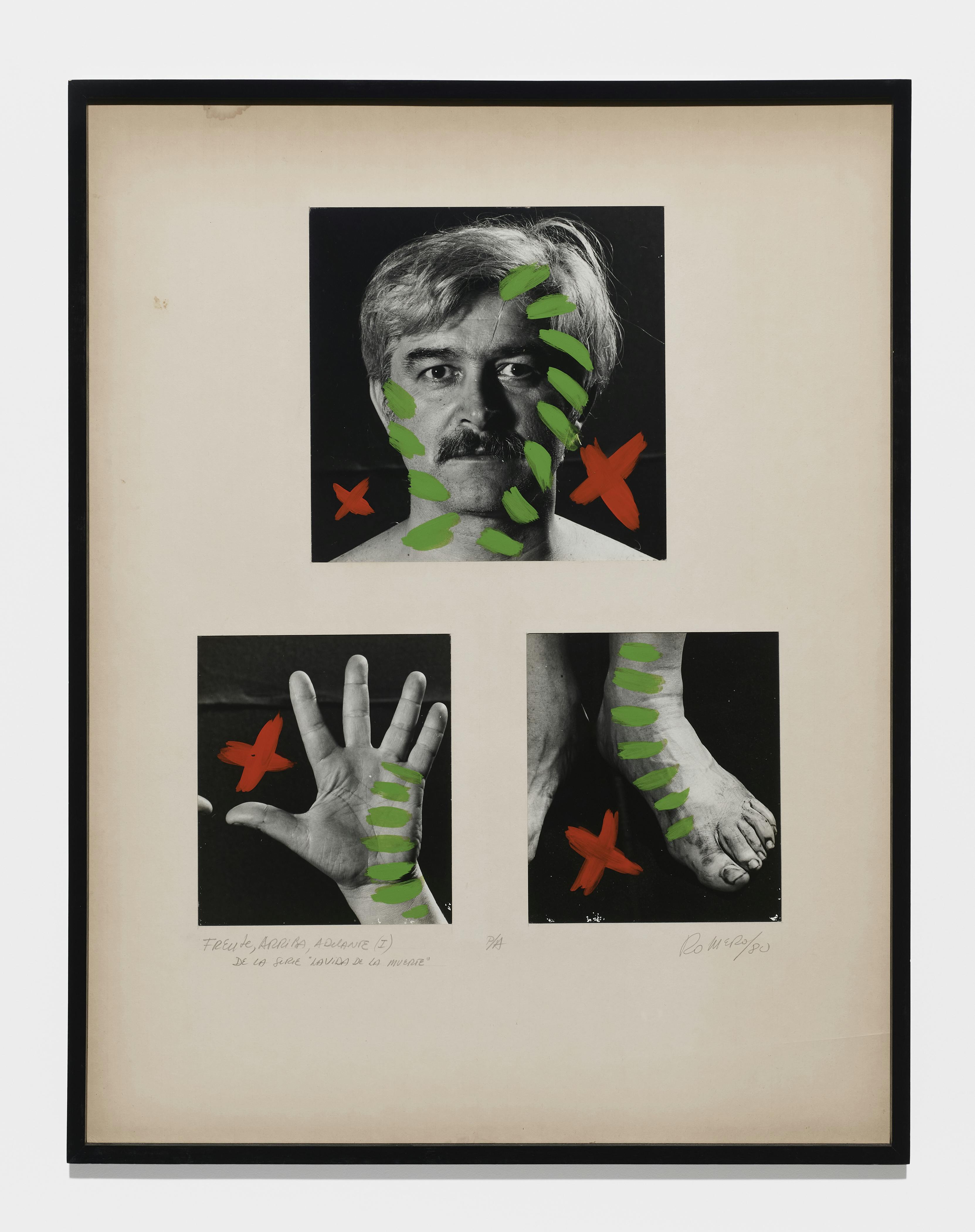 On a sheet of white paper there are three black-and-white photographs arranged in two rows. In the top row is a single photograph of the artist Juan Carlos Romero that looks somewhat like a mugshot. In the bottom row there is a photo of an open hand and another one of the top of a foot. On each of these images, bright red X’s and green striping are painted over the top. The X’s appear in the negative space around the edges of the body parts, while the green striping covers parts of the body near the edges.