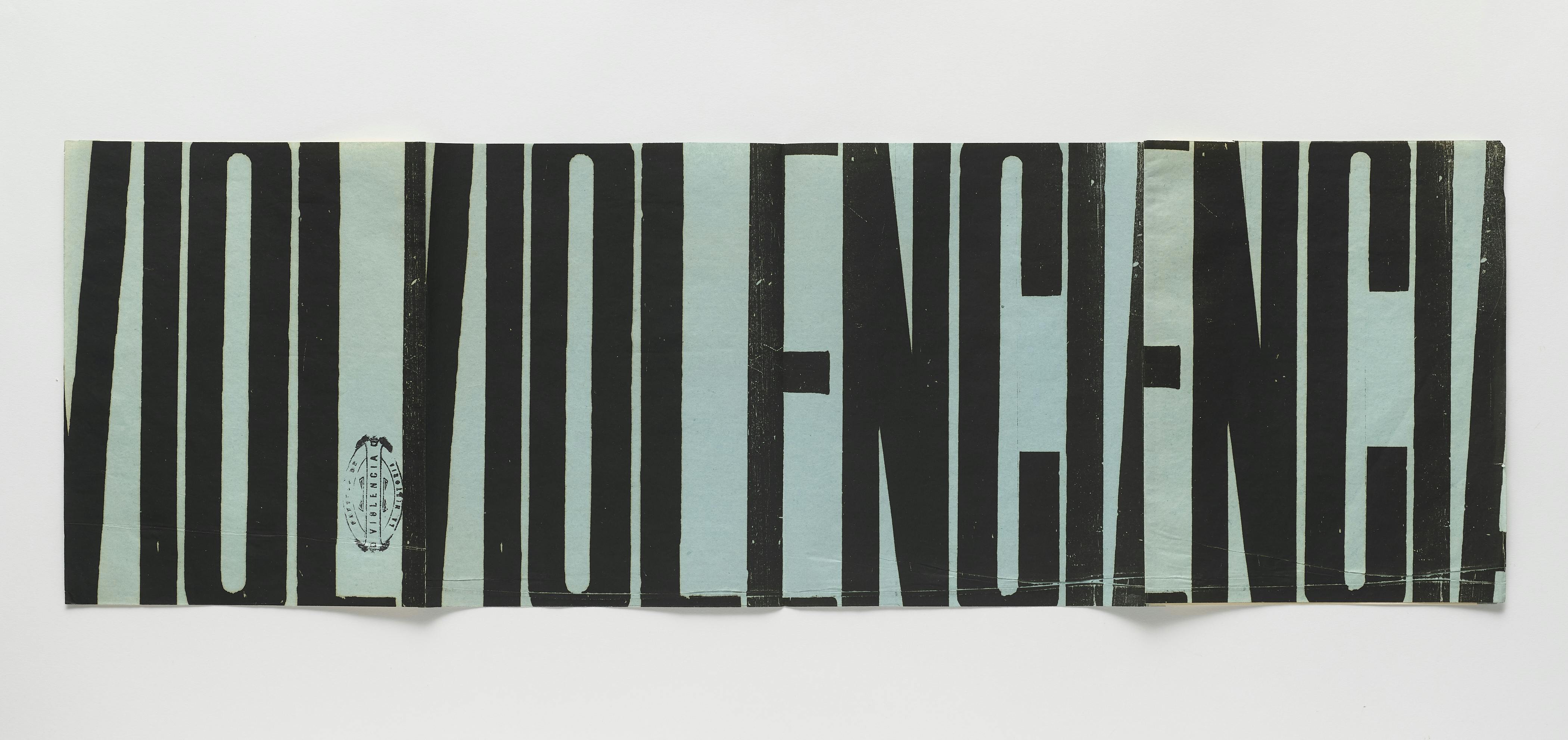 A poster on blue paper with black letters as tall as the paper itself, some fragmented and some whole. From left to right, the poster reads, “VIOL VIOL ENCIA ENCIA.”