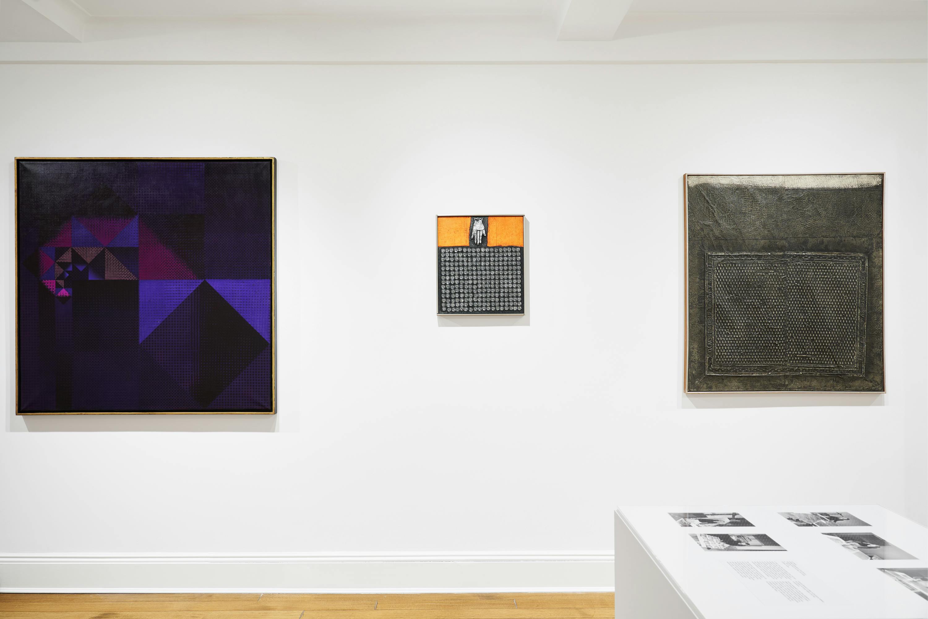 Installation view of a vitrine, two aluminum foil works and one painting by José Antonio Fernández-Muro.