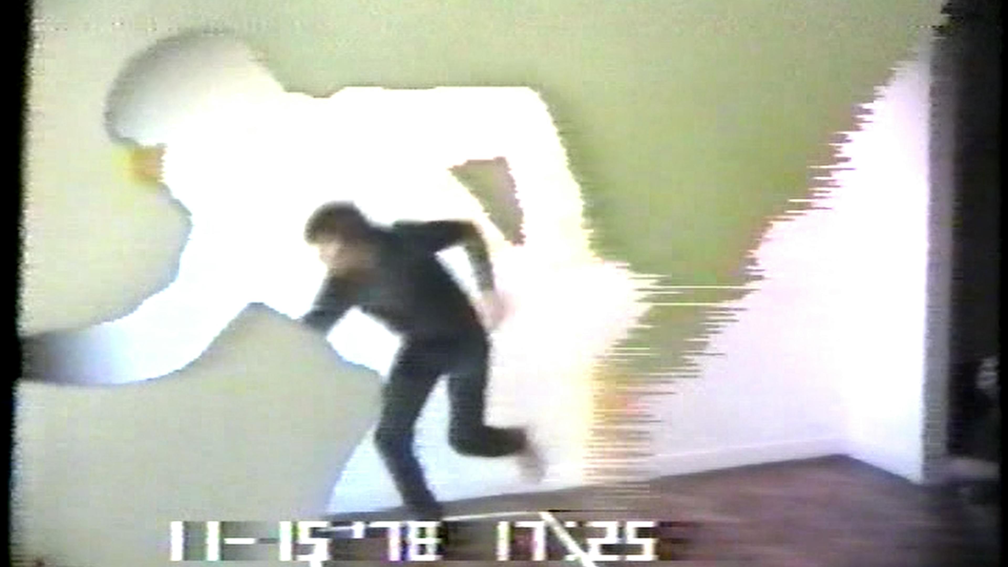 Color film still of figure running