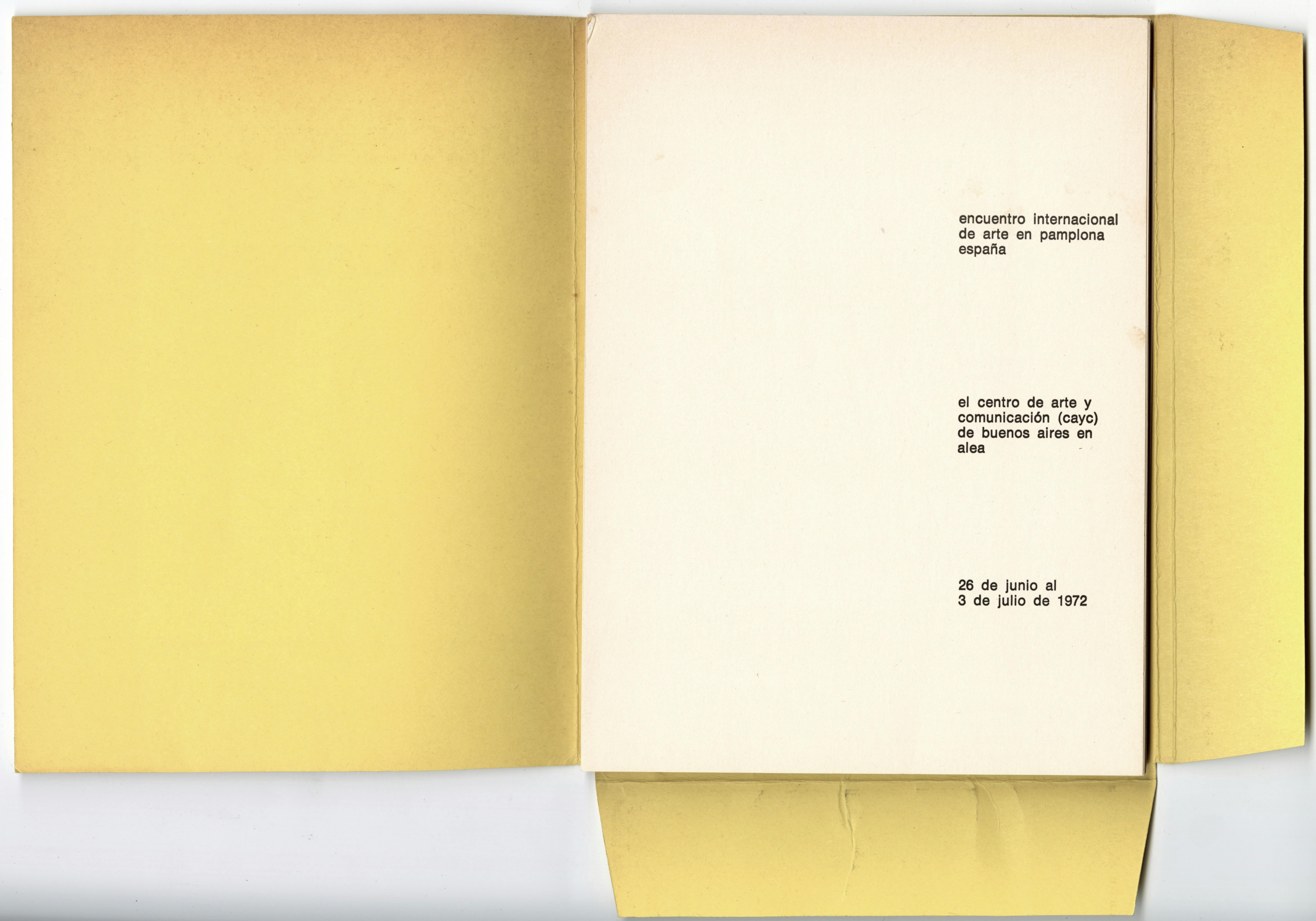 A book with a yellow jacket with flaps on the right and lower edges of the book, opened to the first page. The title of the catalogue, the publisher, and the exhibition dates are printed in black type.