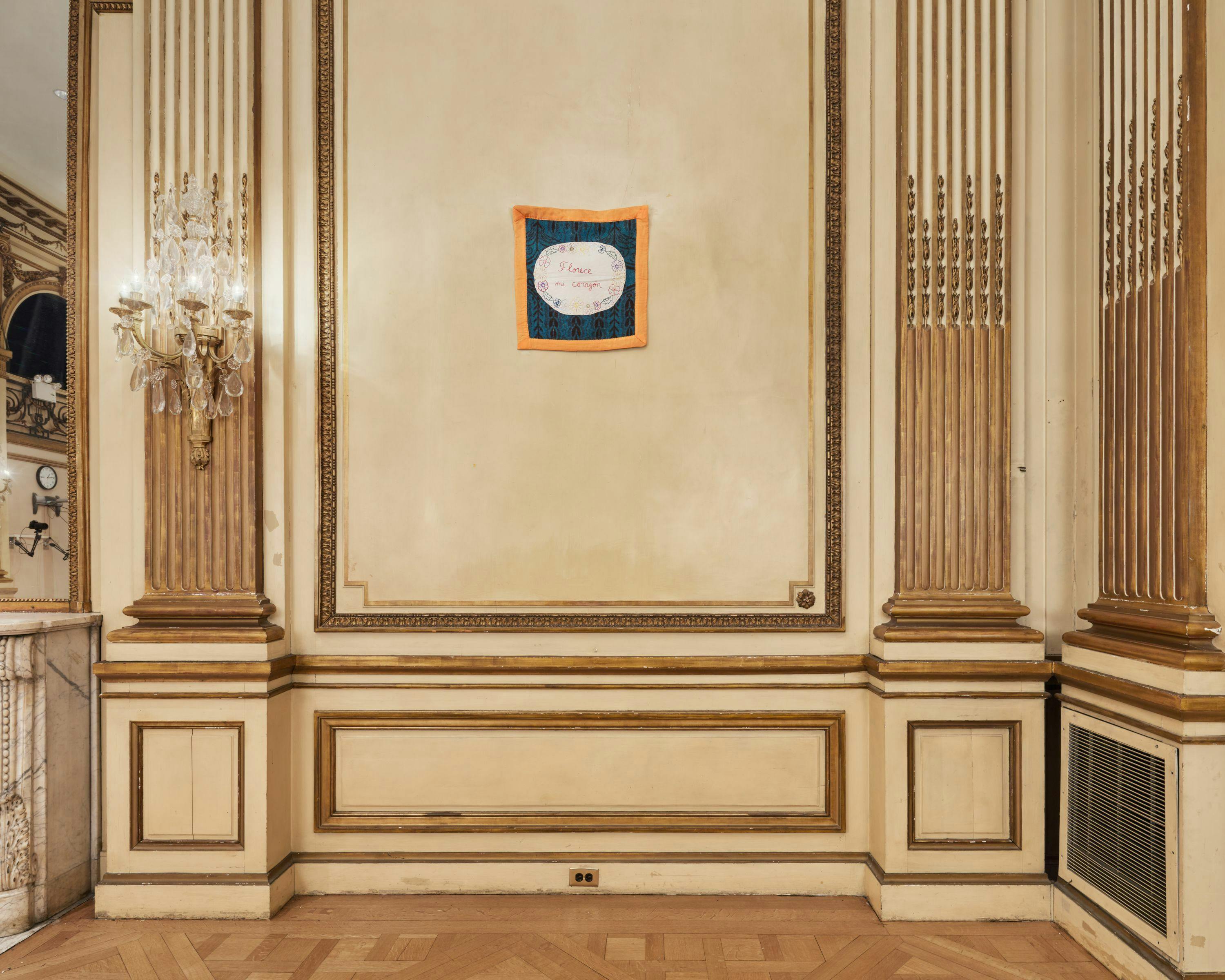 Installation view of the exhibition with artwork framed by wall moldings