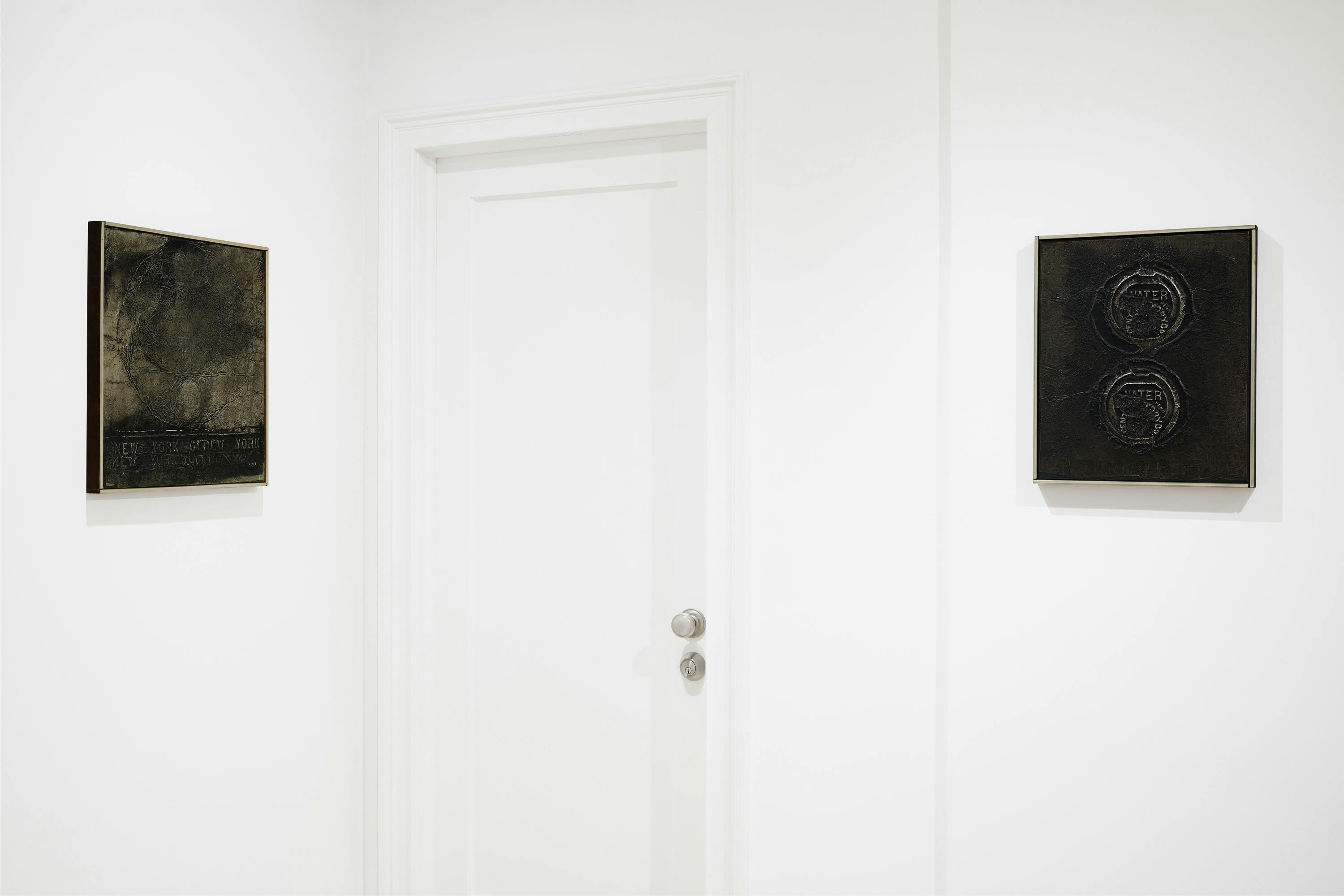 Installation view of two wall-mounted aluminum foil works by José Antonio Fernández-Muro.