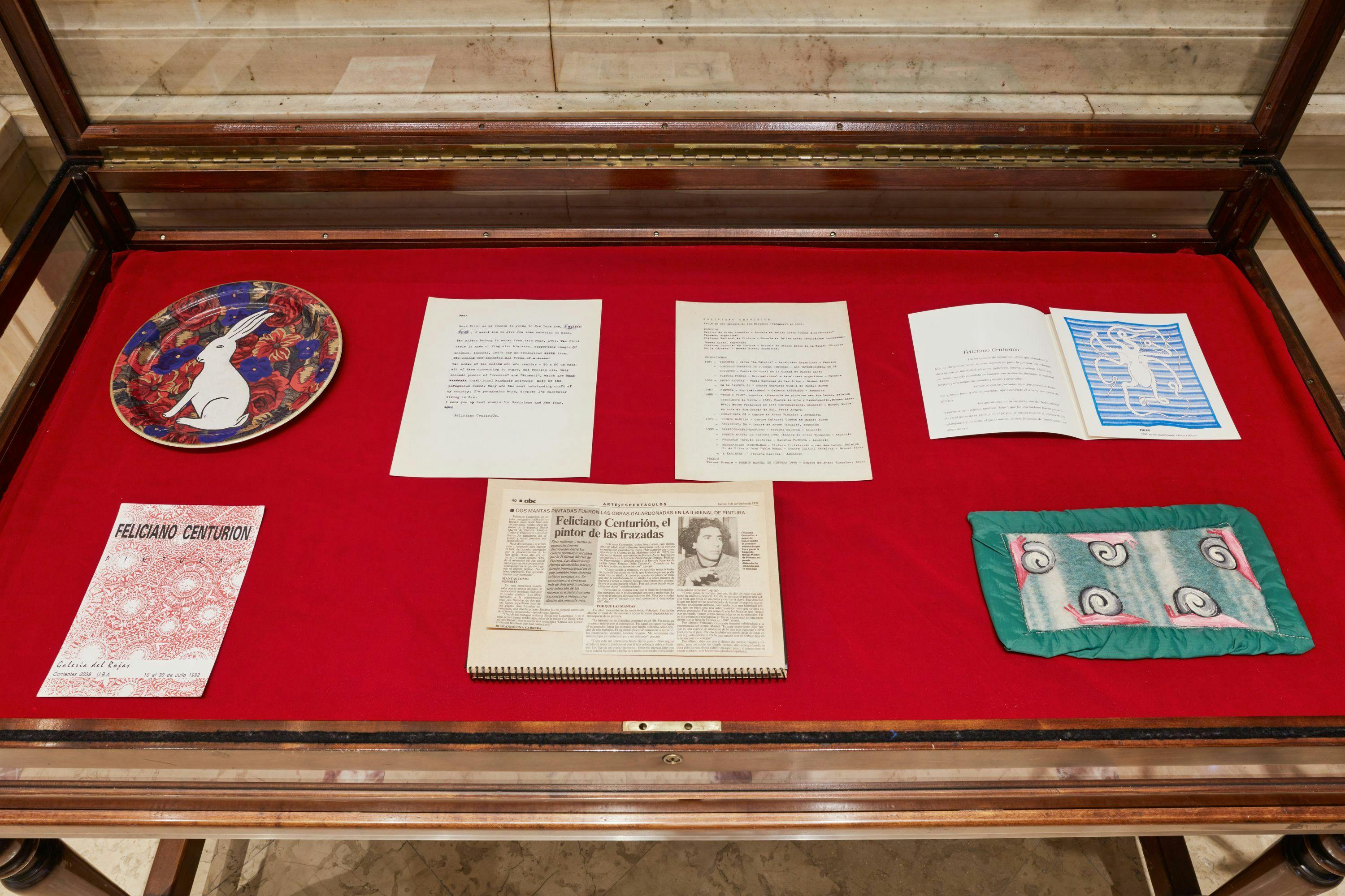 Installation view of archival items in vitrine