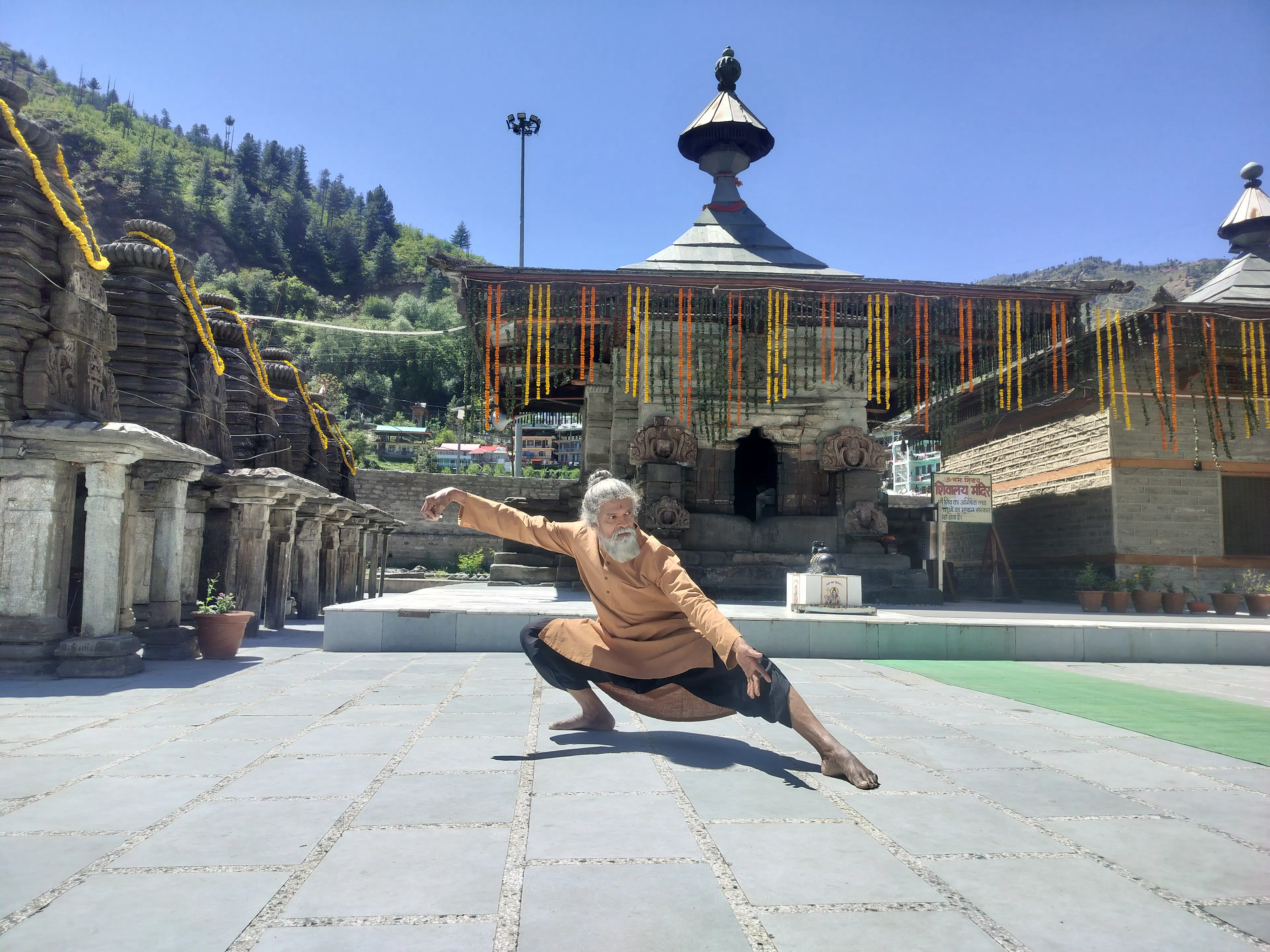 Taichi practitioner in a slow, flowing moving-meditation stance
