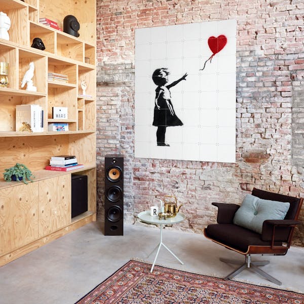 Street art by Banksy on the wall in the living room