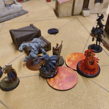 Reva and Swine Cursed models facing off in a Pyre Marker