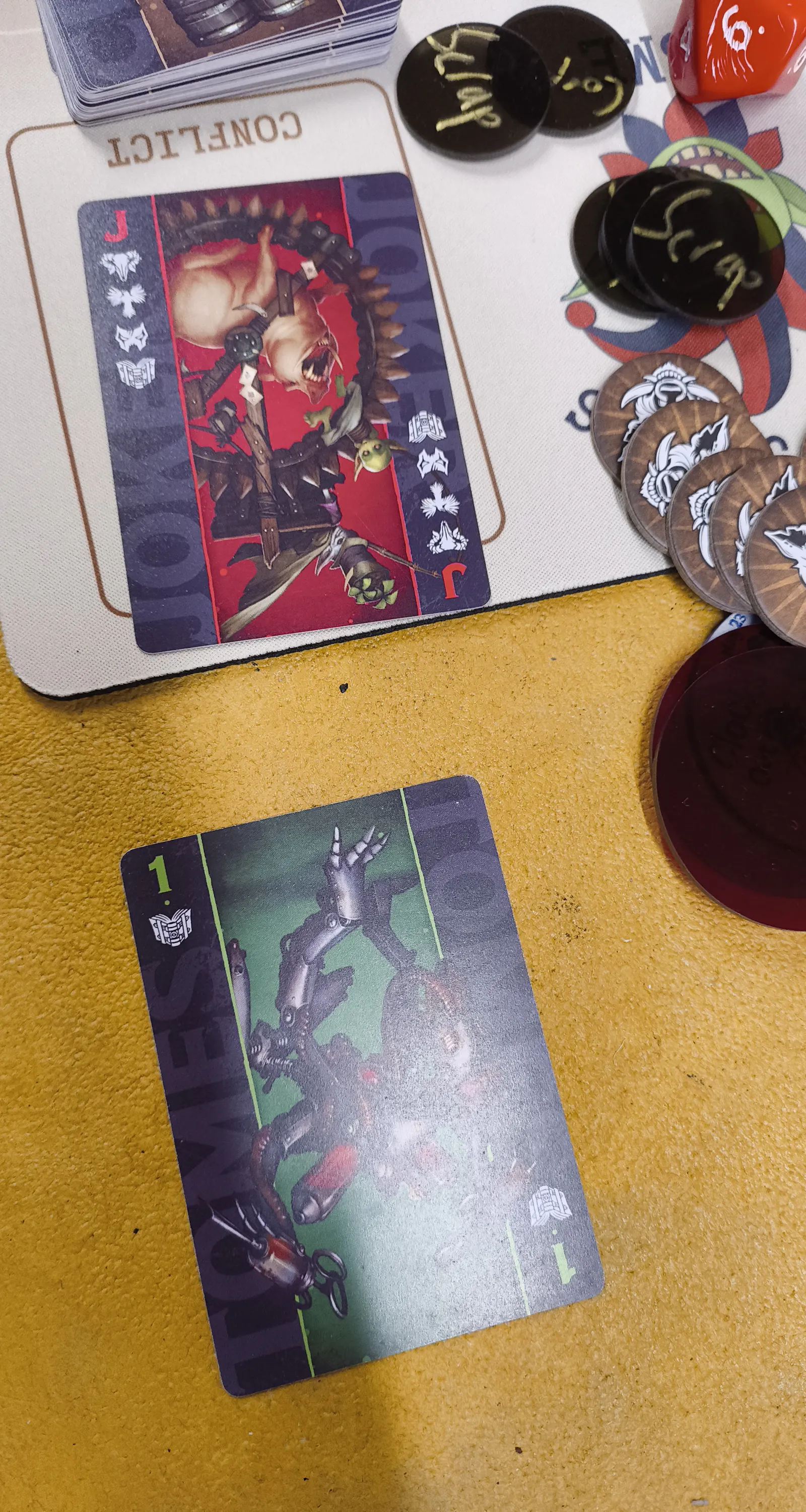 A Malifaux duel where the attacker flipped a 1 and the defender flipped the Red Joker.