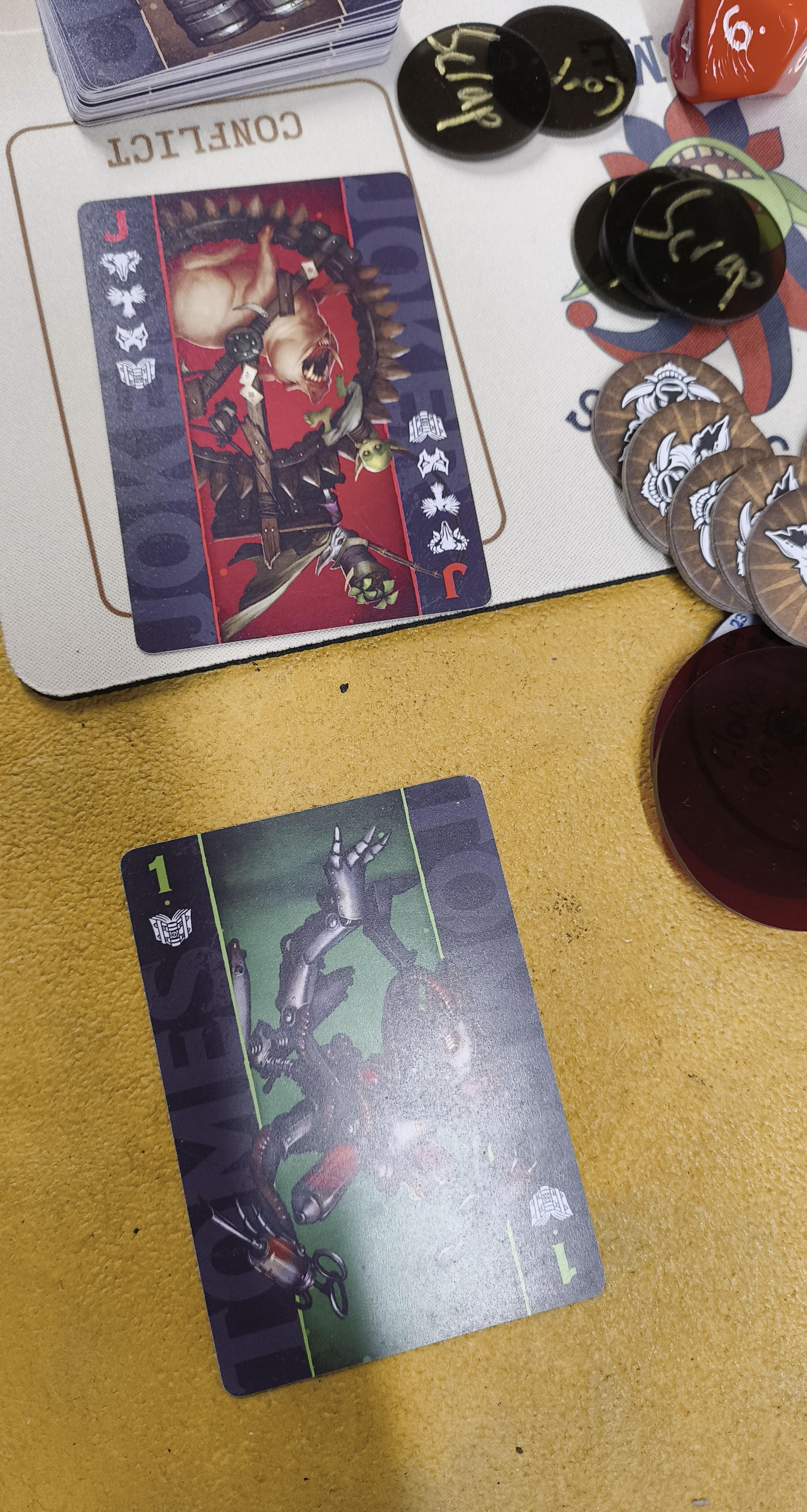 A Malifaux duel where the attacker flipped a 1 and the defender flipped the Red Joker.