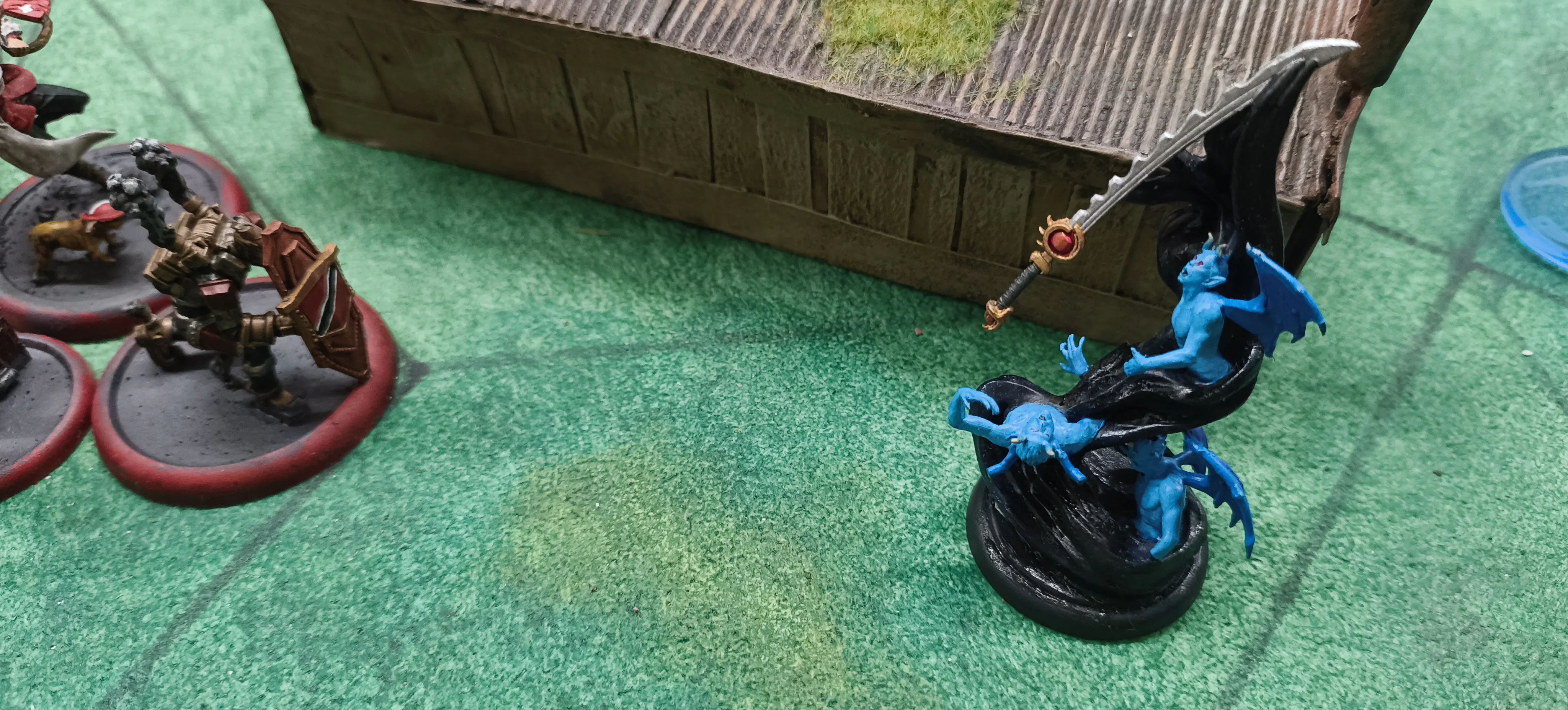 A Marathine and King's Wall Malifaux model face off