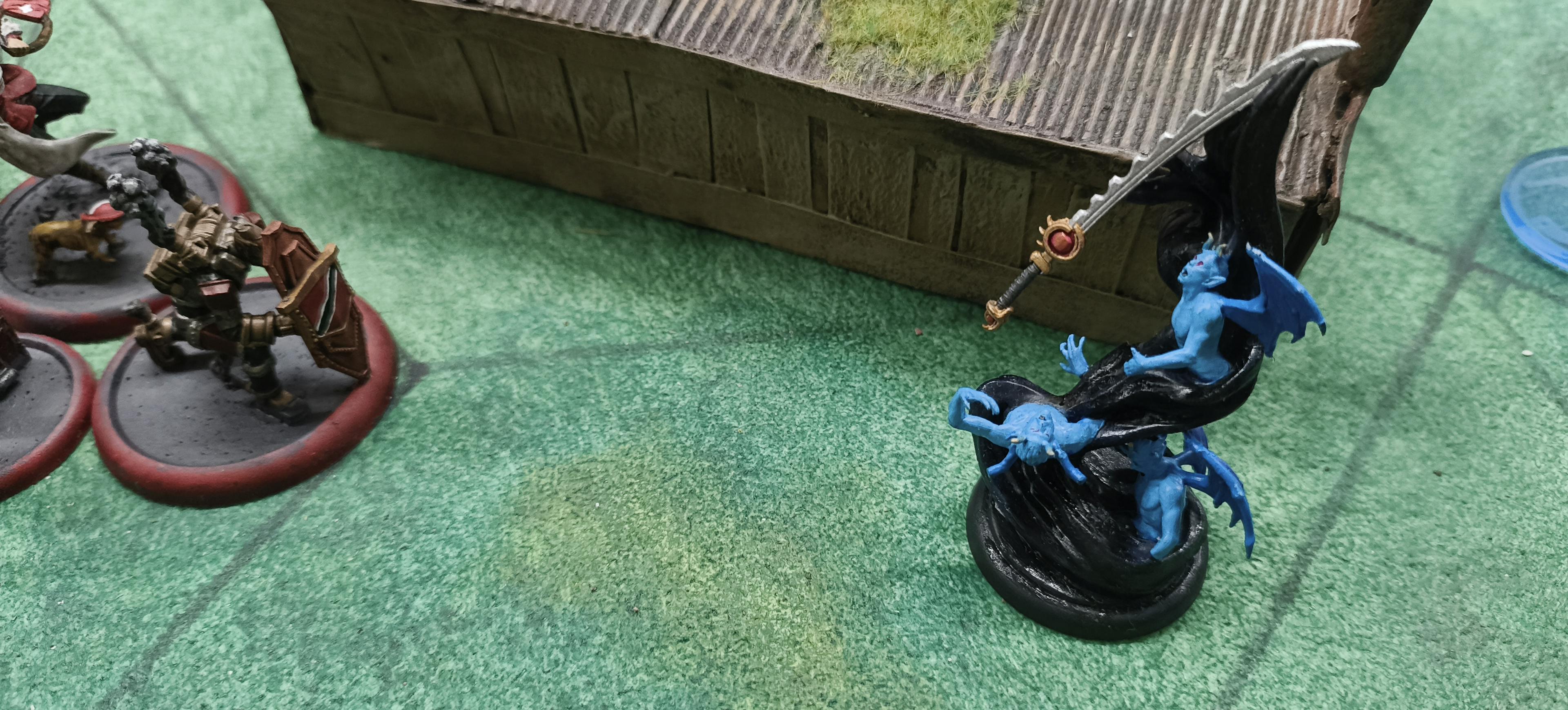 A Marathine and King's Wall Malifaux model face off