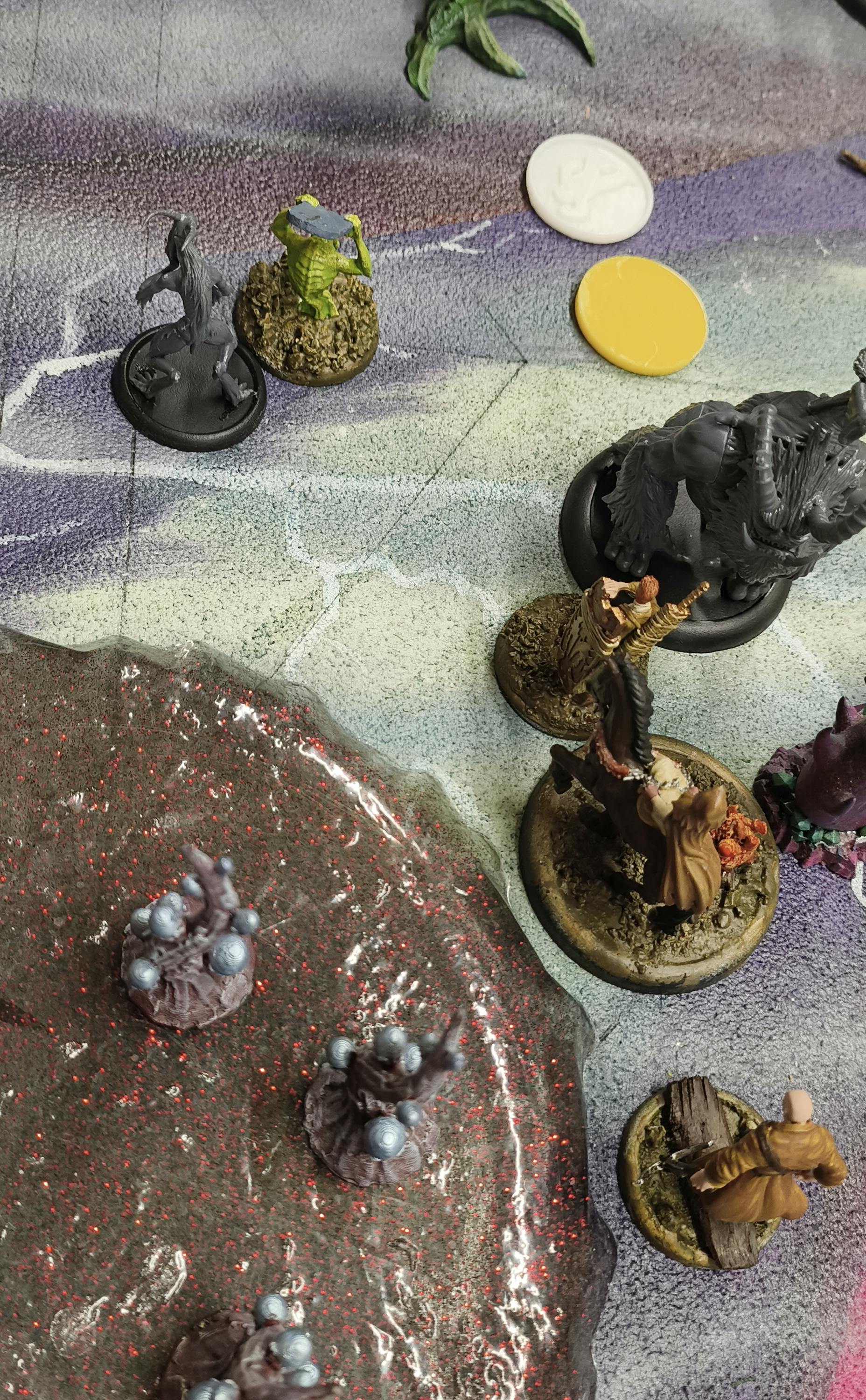 Malifaux Models on a Nightmare themed board.