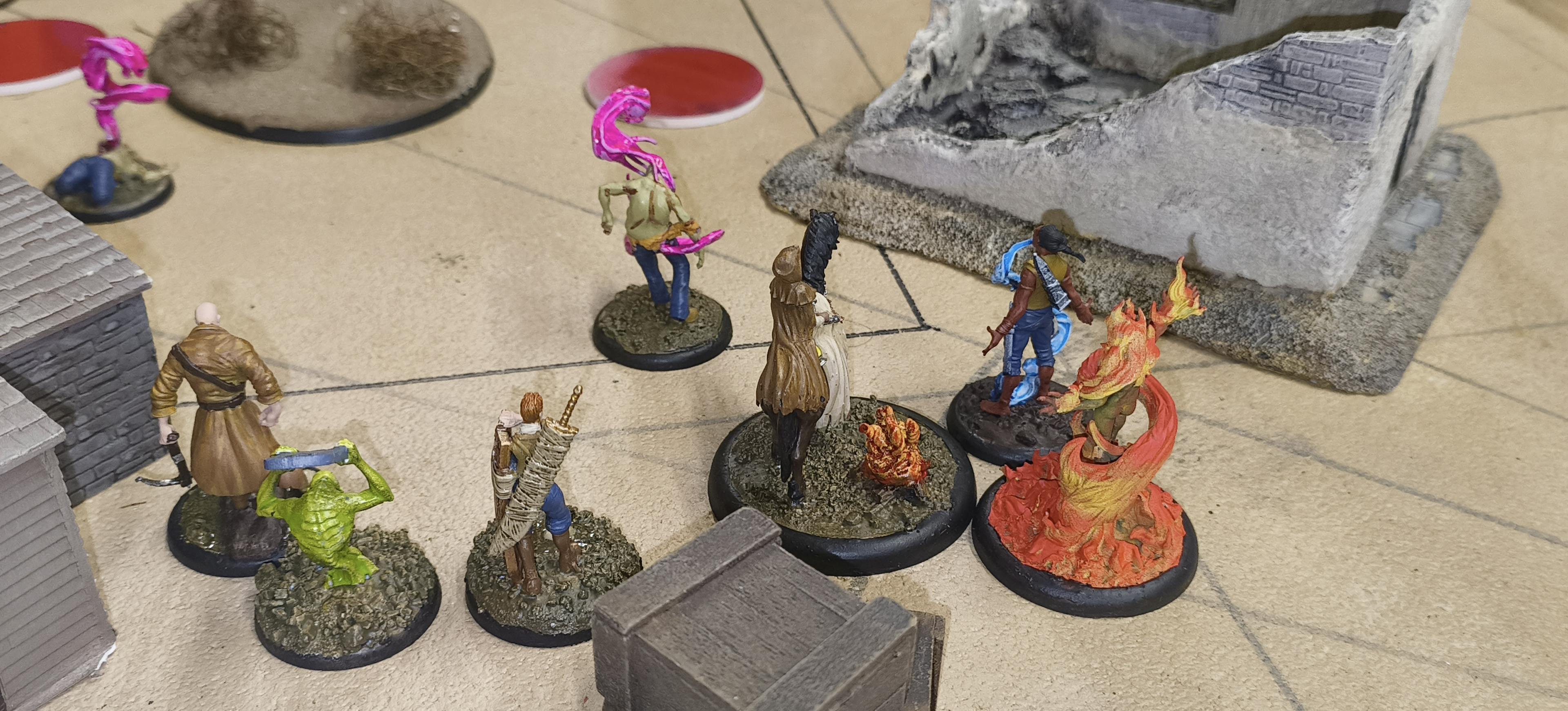 Some Malifaux models on a desert themed table.