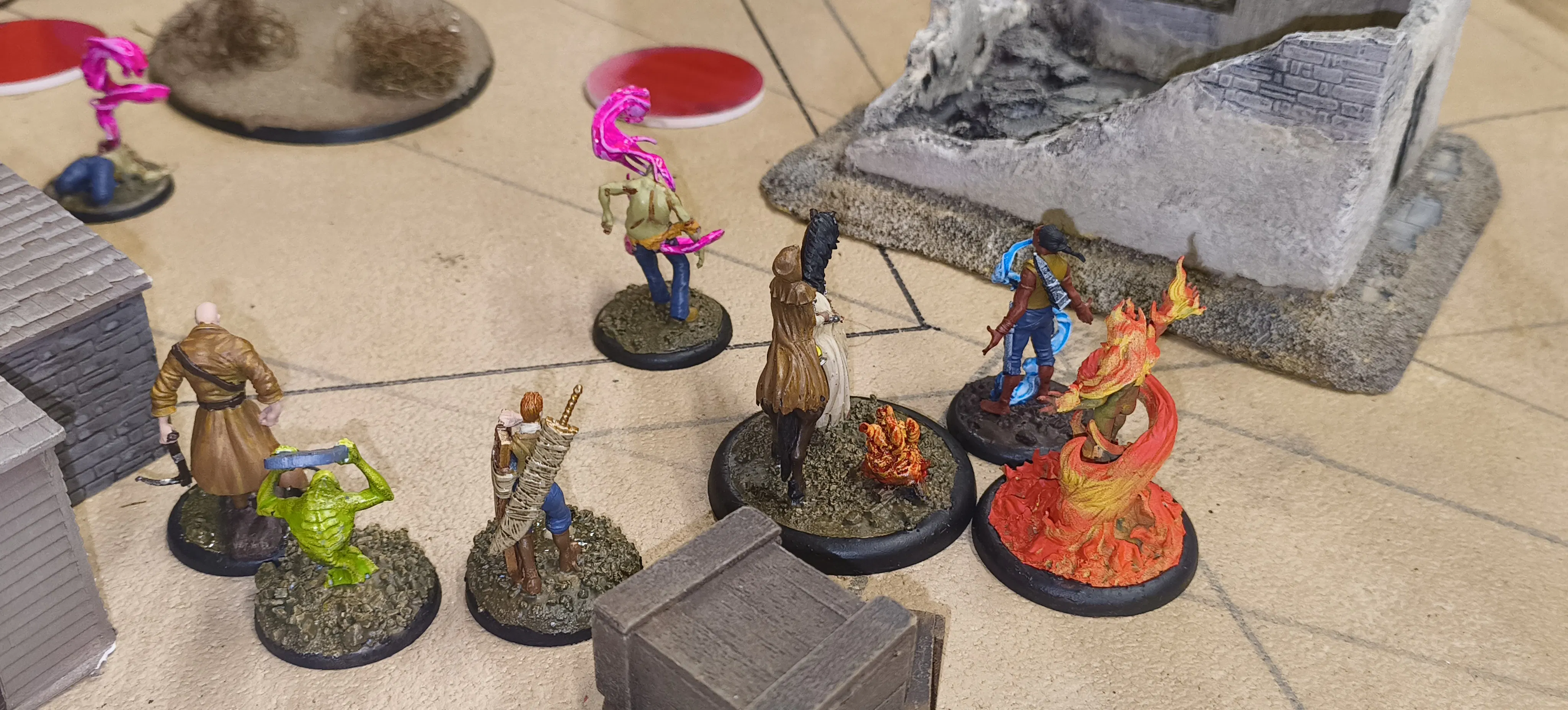 Some Malifaux models on a desert themed table.
