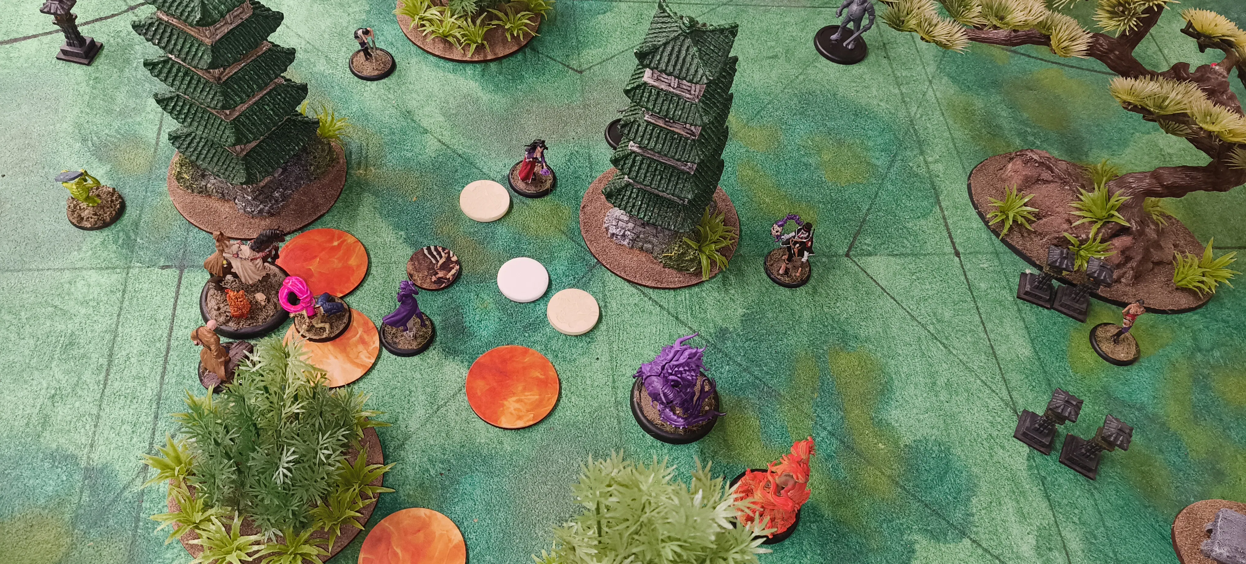 Revenant and Honeypot models battling in an Oriental Garden board