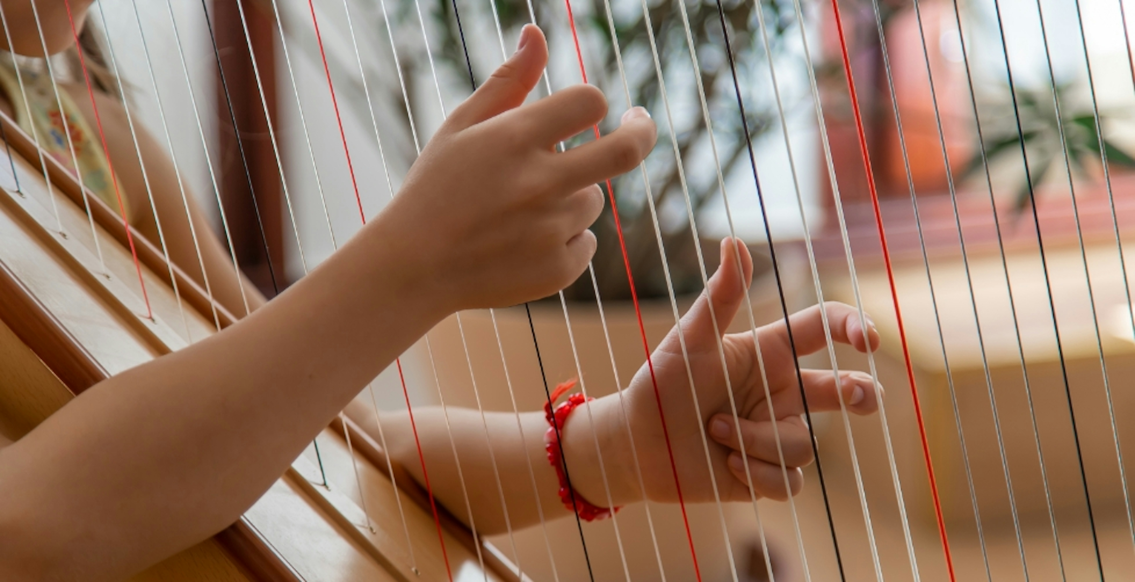 Child plays harp