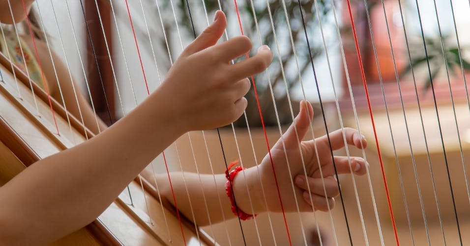 Child playing the harp