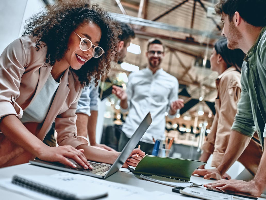 business professionals working together and smiling 