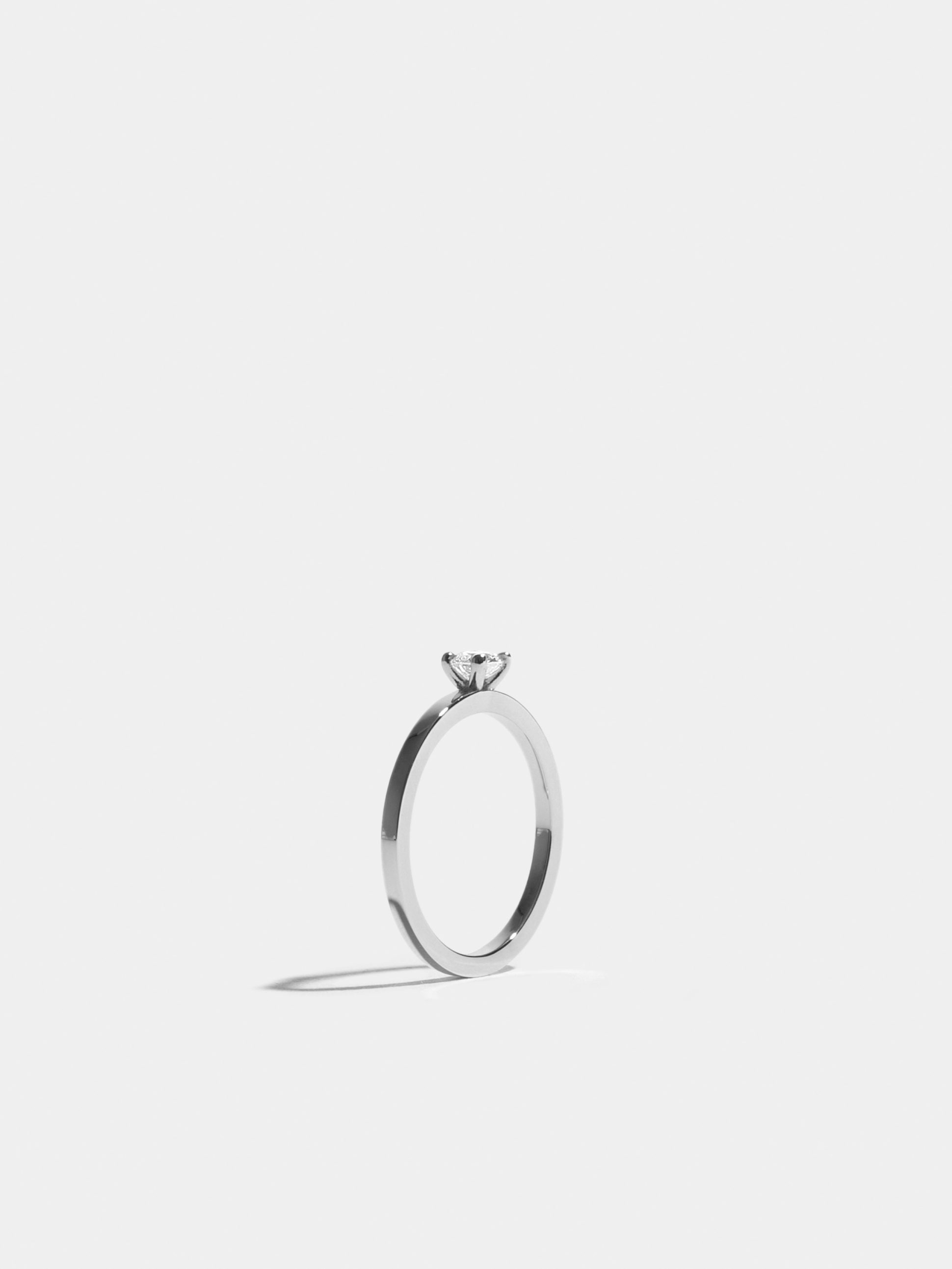 Solitaire Anagramme flat ribbon in white gold 18k Fairmined ethical set with a 0.30 carat brilliant cut synthetic diamond