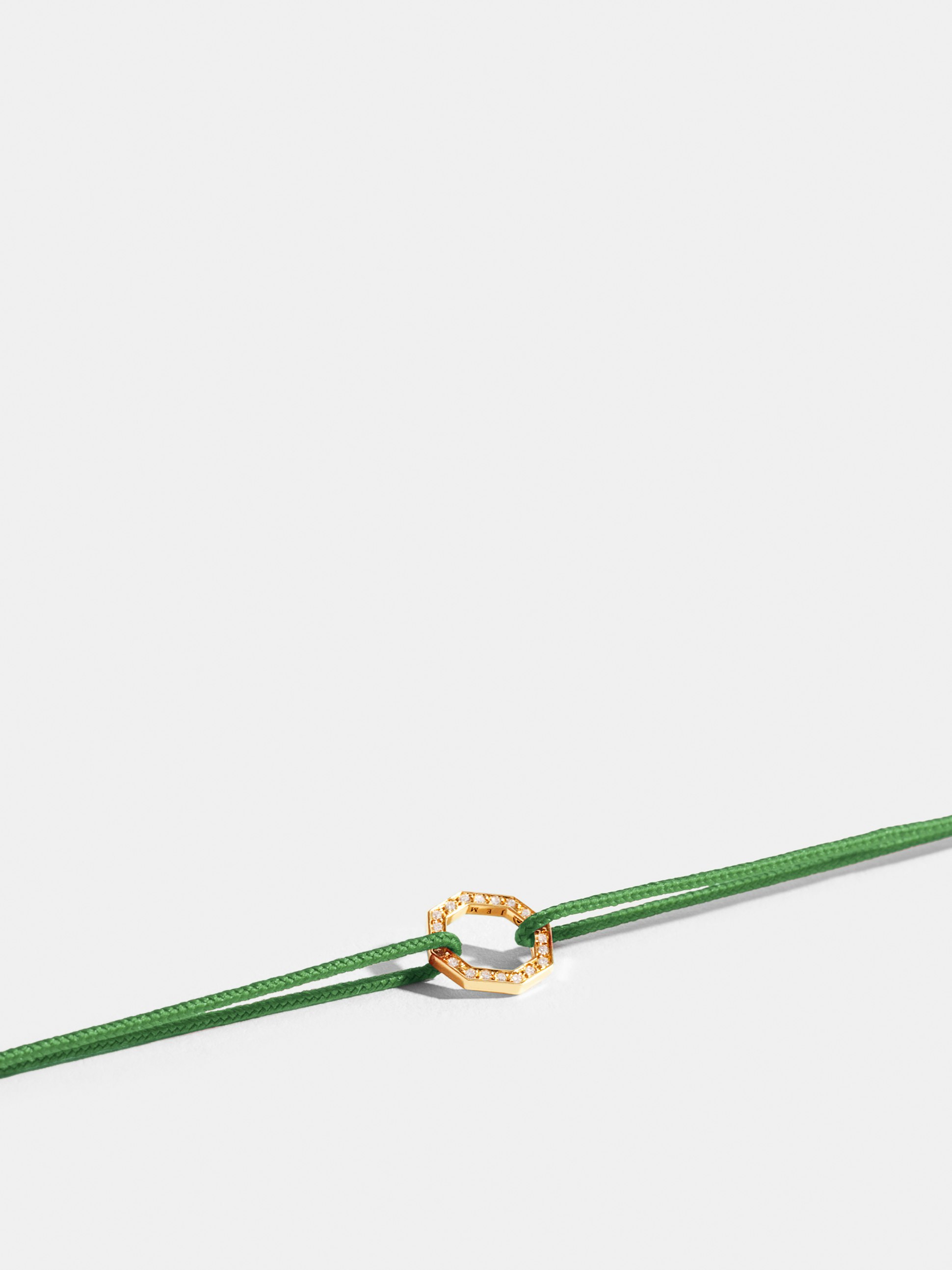 Octogone motif in 18k Fairmined ethical yellow gold, paved with lab-grown diamonds, on an apple green cord.