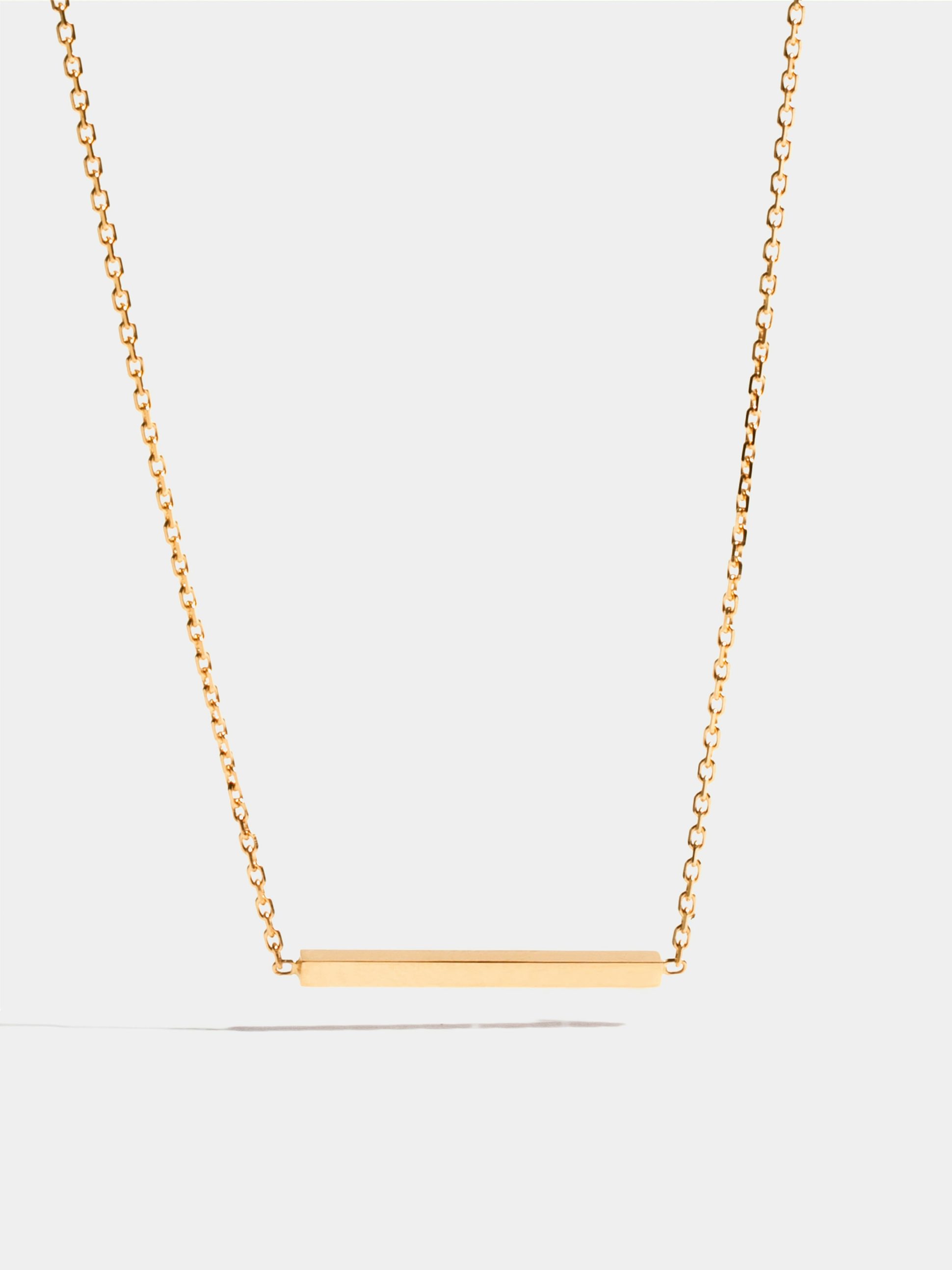 Motif Anagramme poli en Or jaune éthique 18 carats certifié Fairmined, sur chaîne de 42 cm.