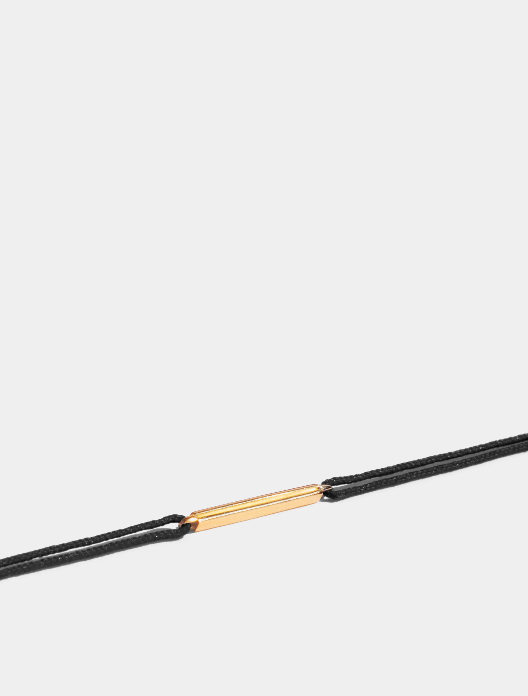 Motif Anagramme double-jonc en Or jaune éthique 18 carats certifié Fairmined, sur cordon