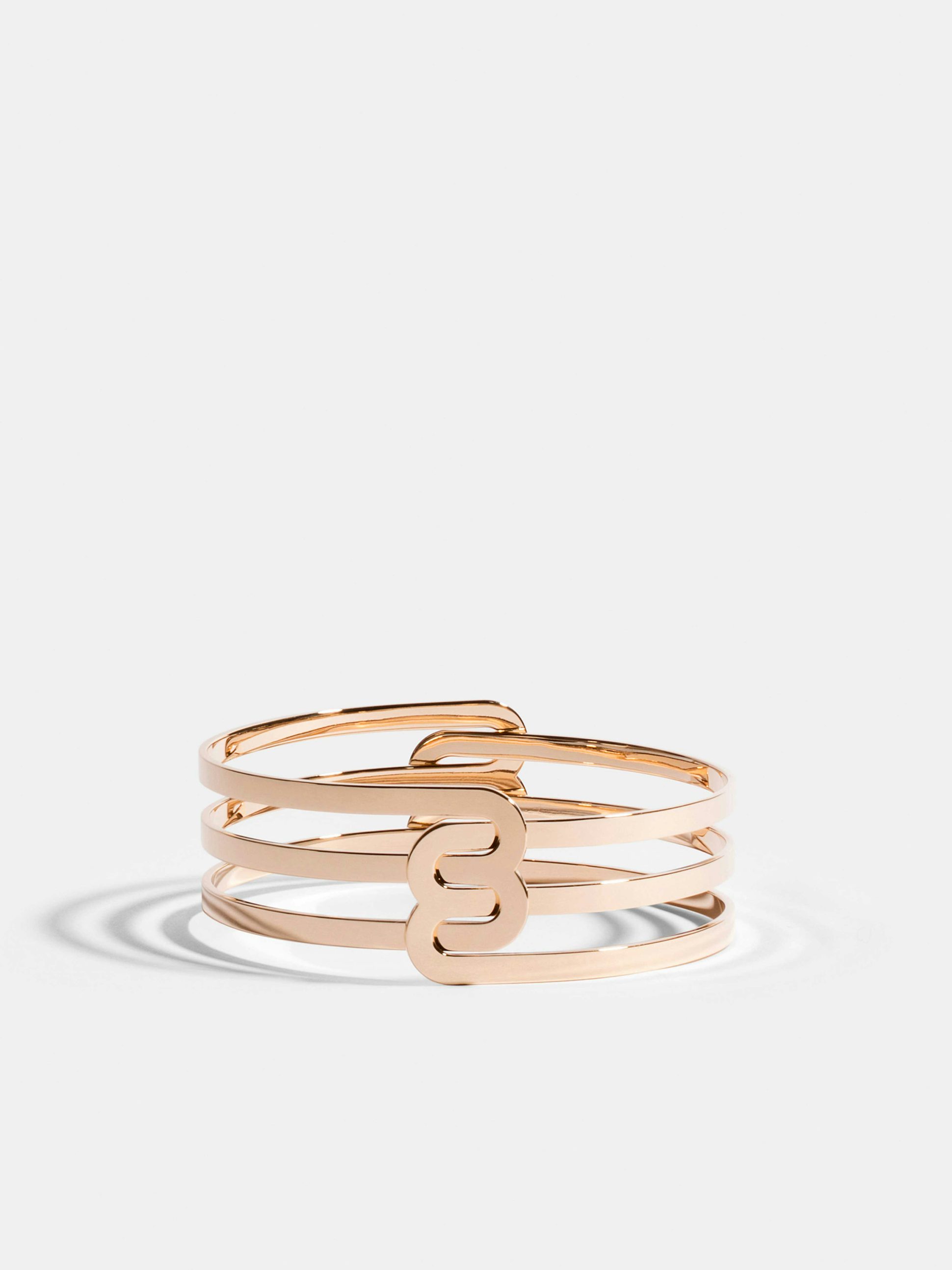Bracelet Étreintes en Or rose éthique 18 carats certifié Fairmined composé de deux demi-bracelets doubles finition poli-brillant.