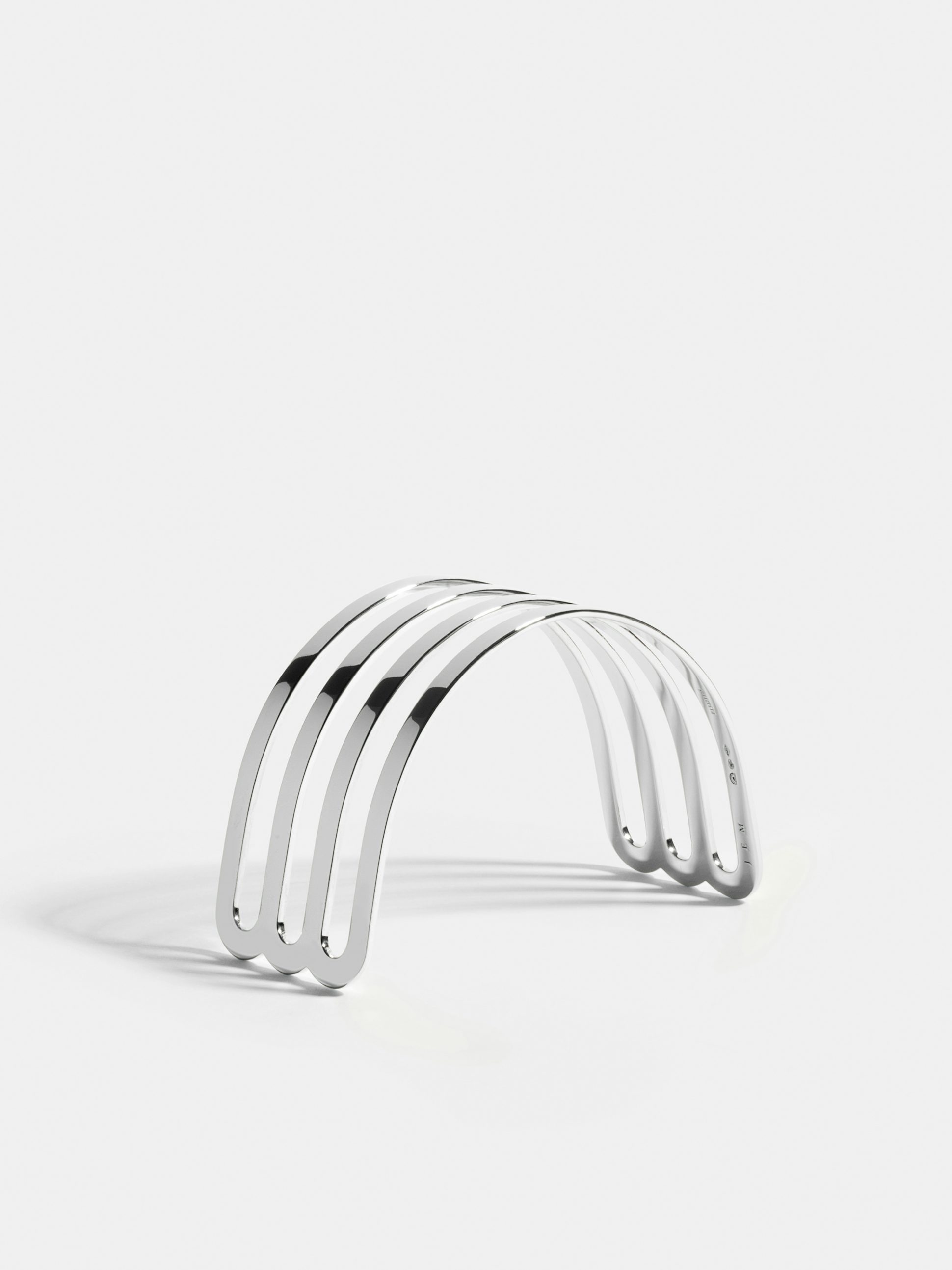 Étreintes triple half-bracelet in 18k Fairmined ethical white gold with a polished finish.