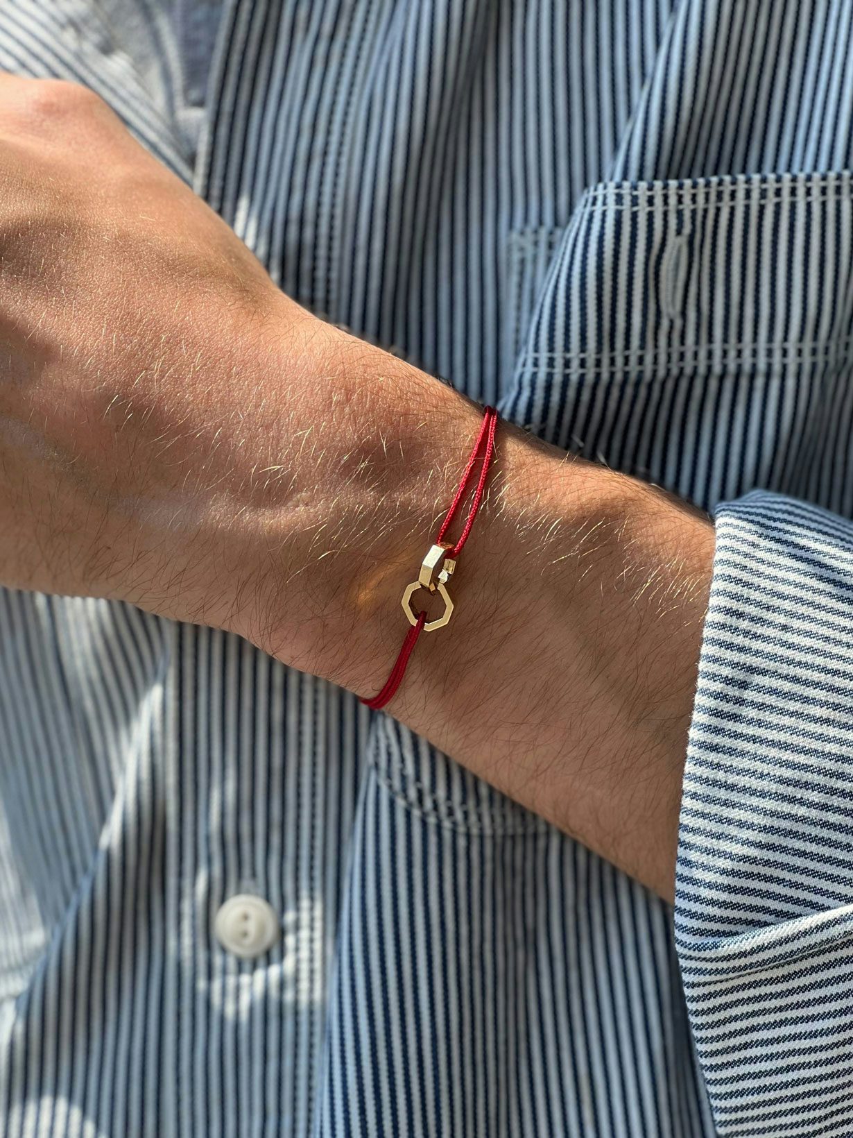 Double Octogone bracelet in 18k Fairmined ethical rose gold, on a red cord. 