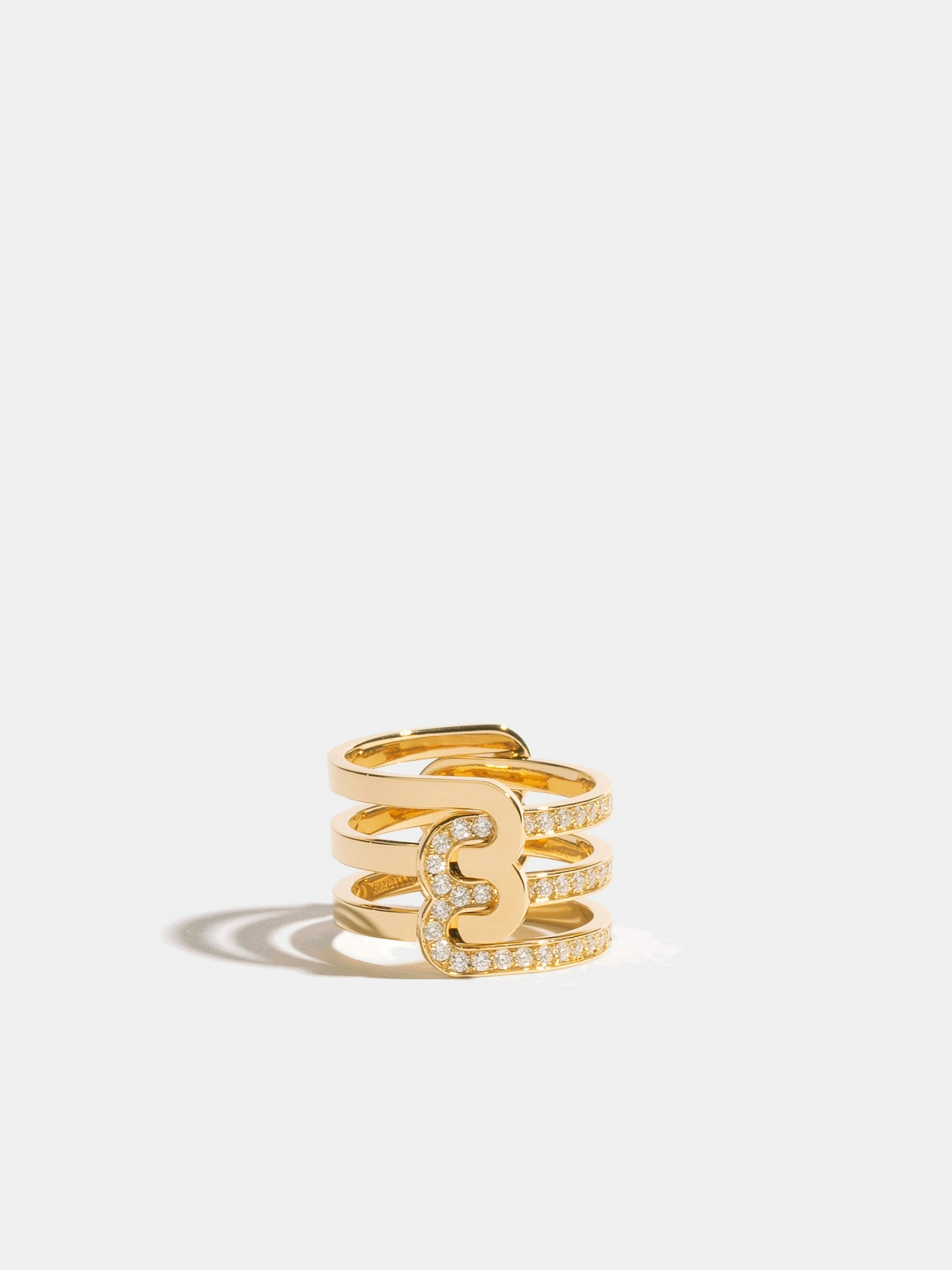 Ethical 18k yellow gold Fairmined ring composed of a double half-ring polished finish and a double half-ring paved with synthetic diamonds.
