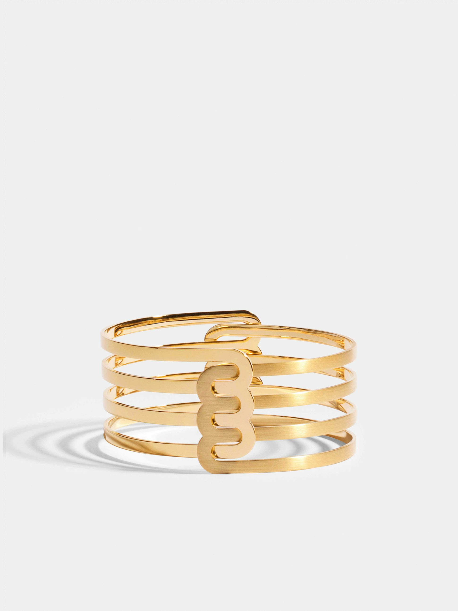 Bracelet Étreintes en Or jaune éthique 18 carats certifié Fairmined composé d'un demi-bracelet triple finition poli-brillant et d'un demi-bracelet triple finition brossée.