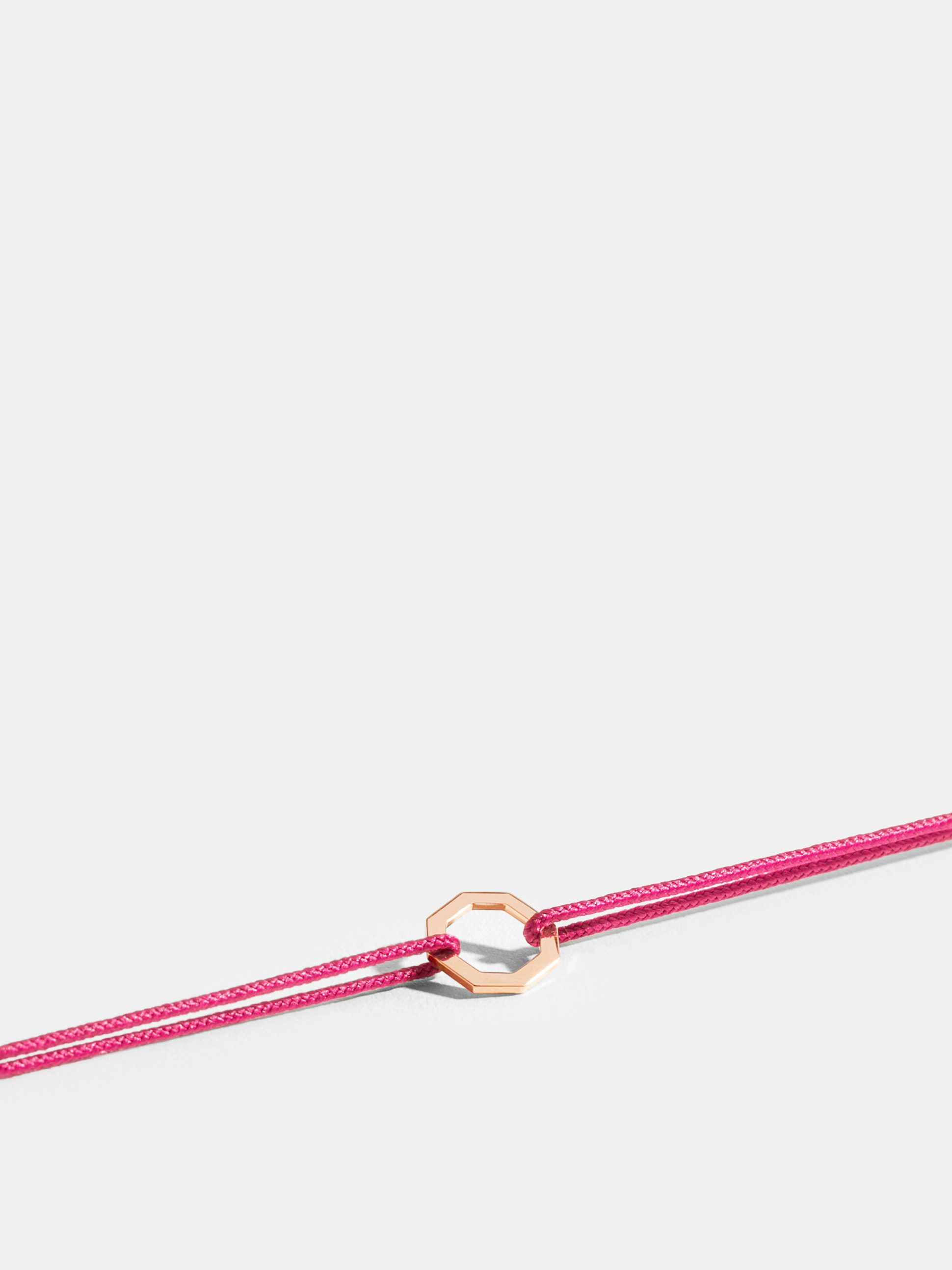 Octogone motif in 18k Fairmined ethical rose gold, on a fuschia pink cord.