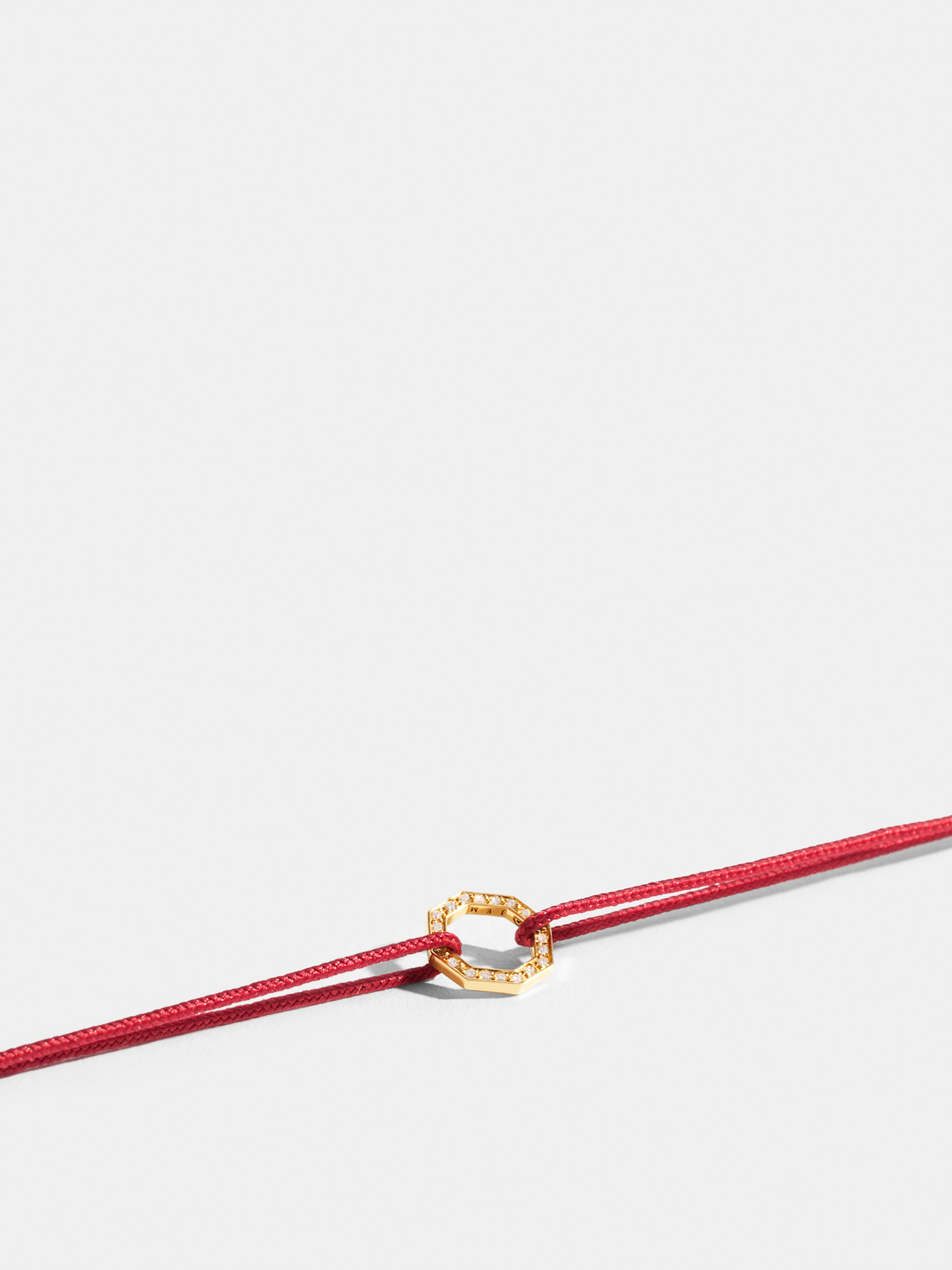 Octogone motif in 18k Fairmined ethical yellow gold, paved with lab-grown diamonds, on a puppy red cord.