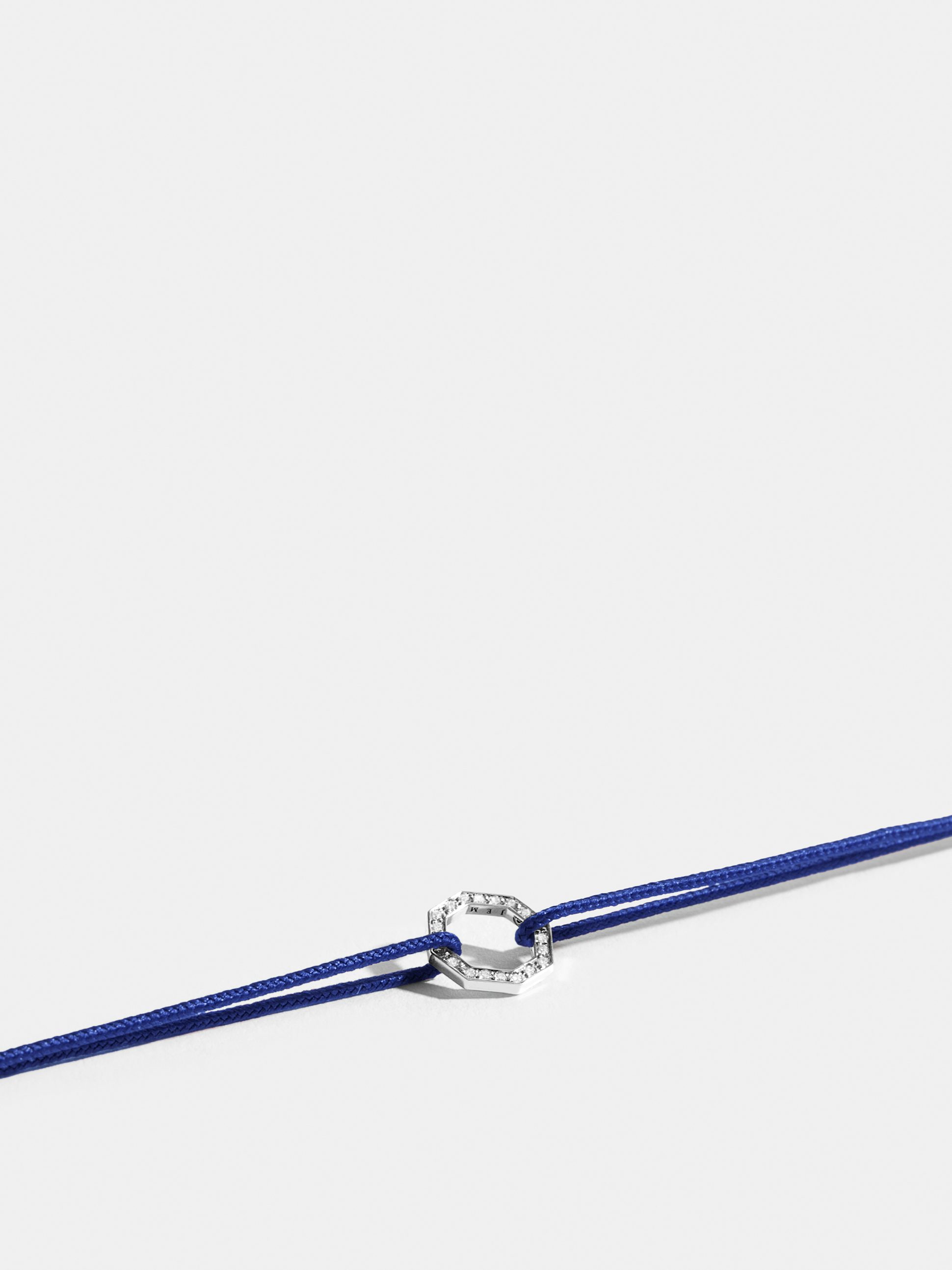 Octogone motif in 18k Fairmined ethical white gold, paved with lab-grown diamonds, on a klein blue cord.