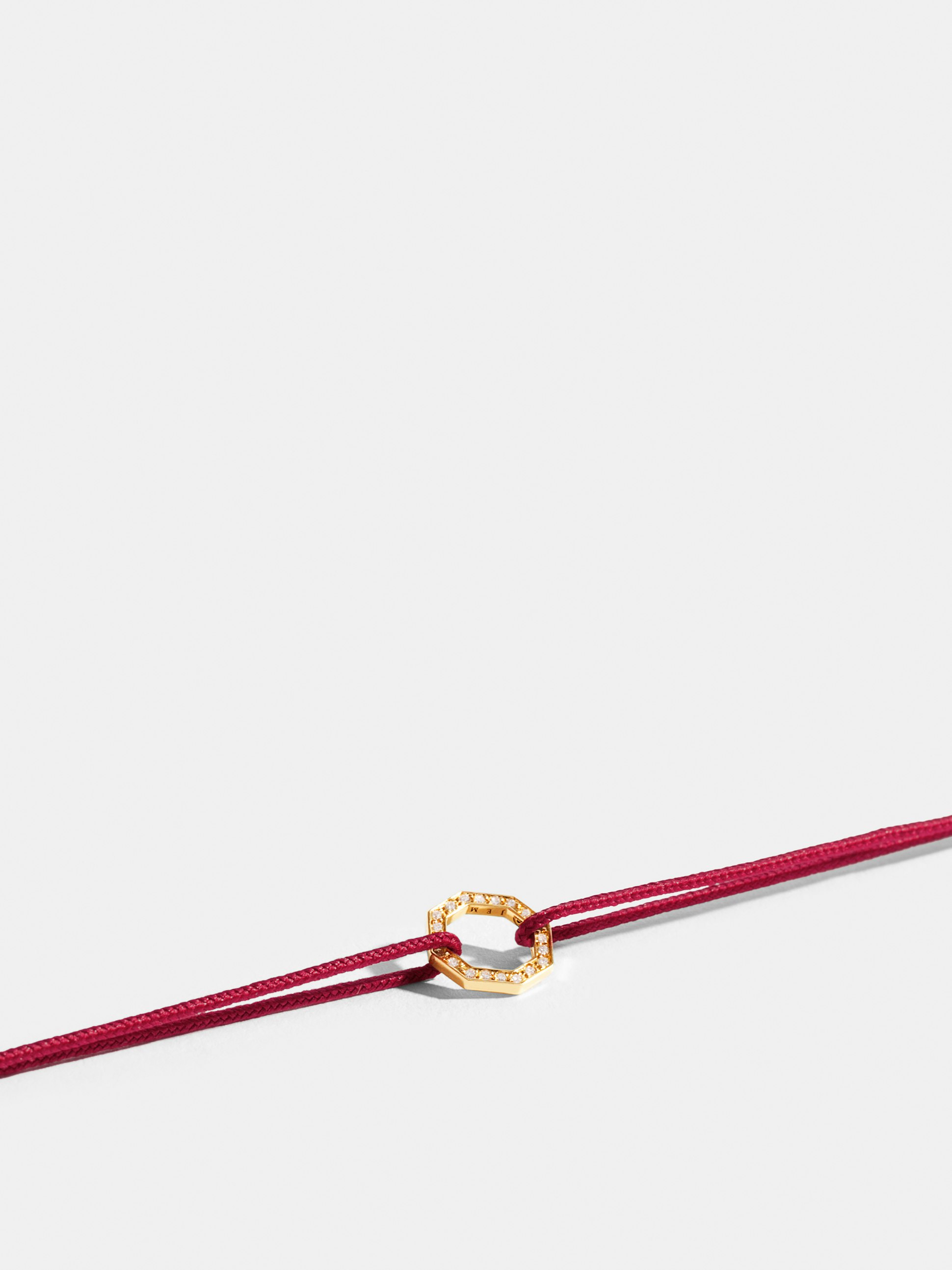 Octogone motif in 18k Fairmined ethical yellow gold, paved with lab-grown diamonds, on a carmine red cord.