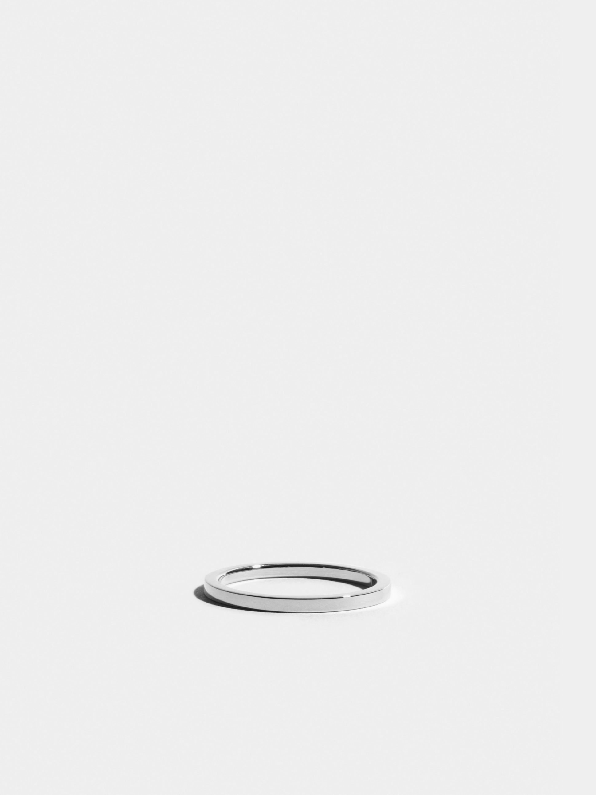 Anagramme flat ribbon ring in 18k Fairmined ethical white gold