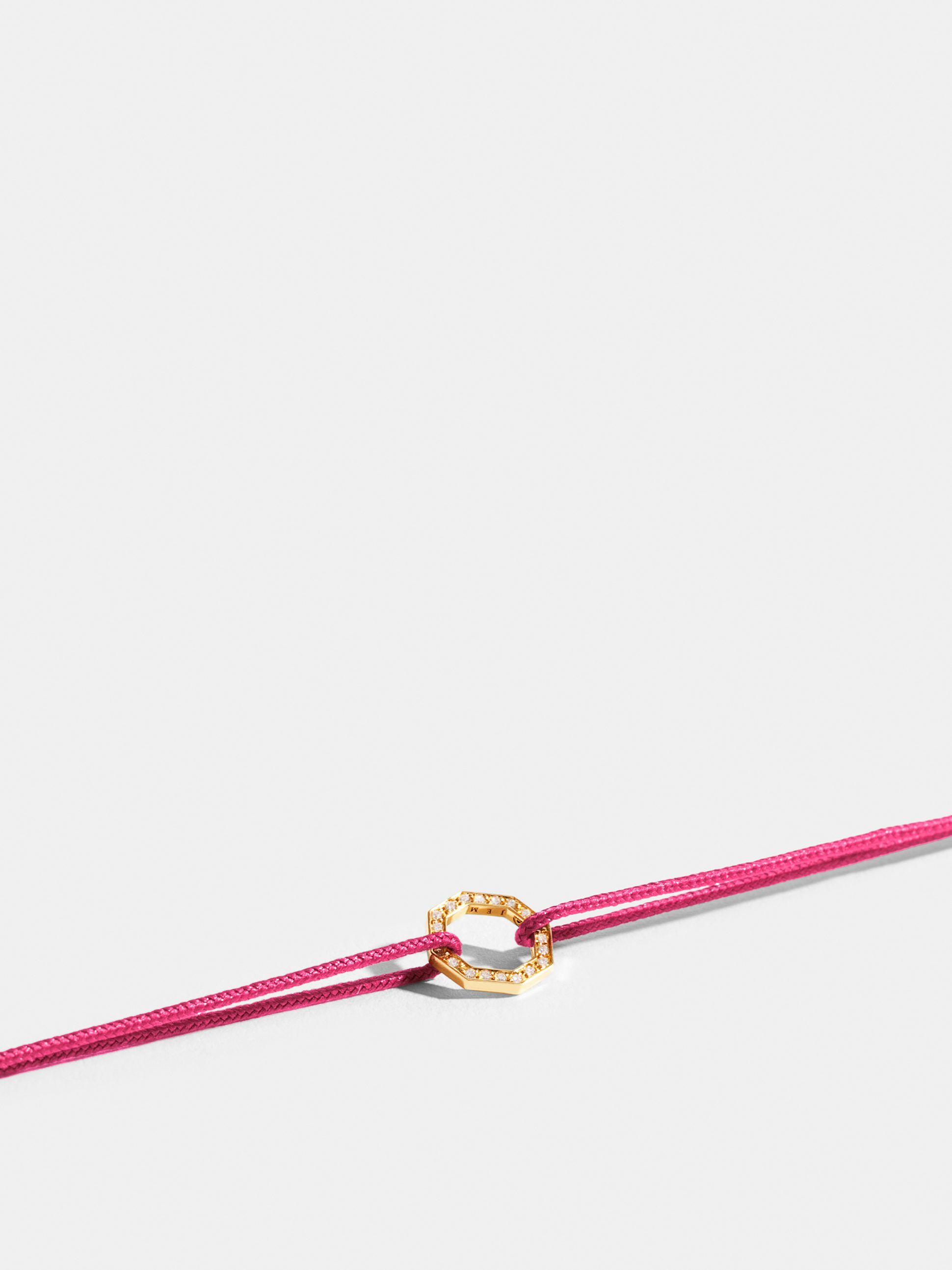 Octogone motif in 18k Fairmined ethical yellow gold, paved with lab-grown diamonds, on a fuschia pink cord.