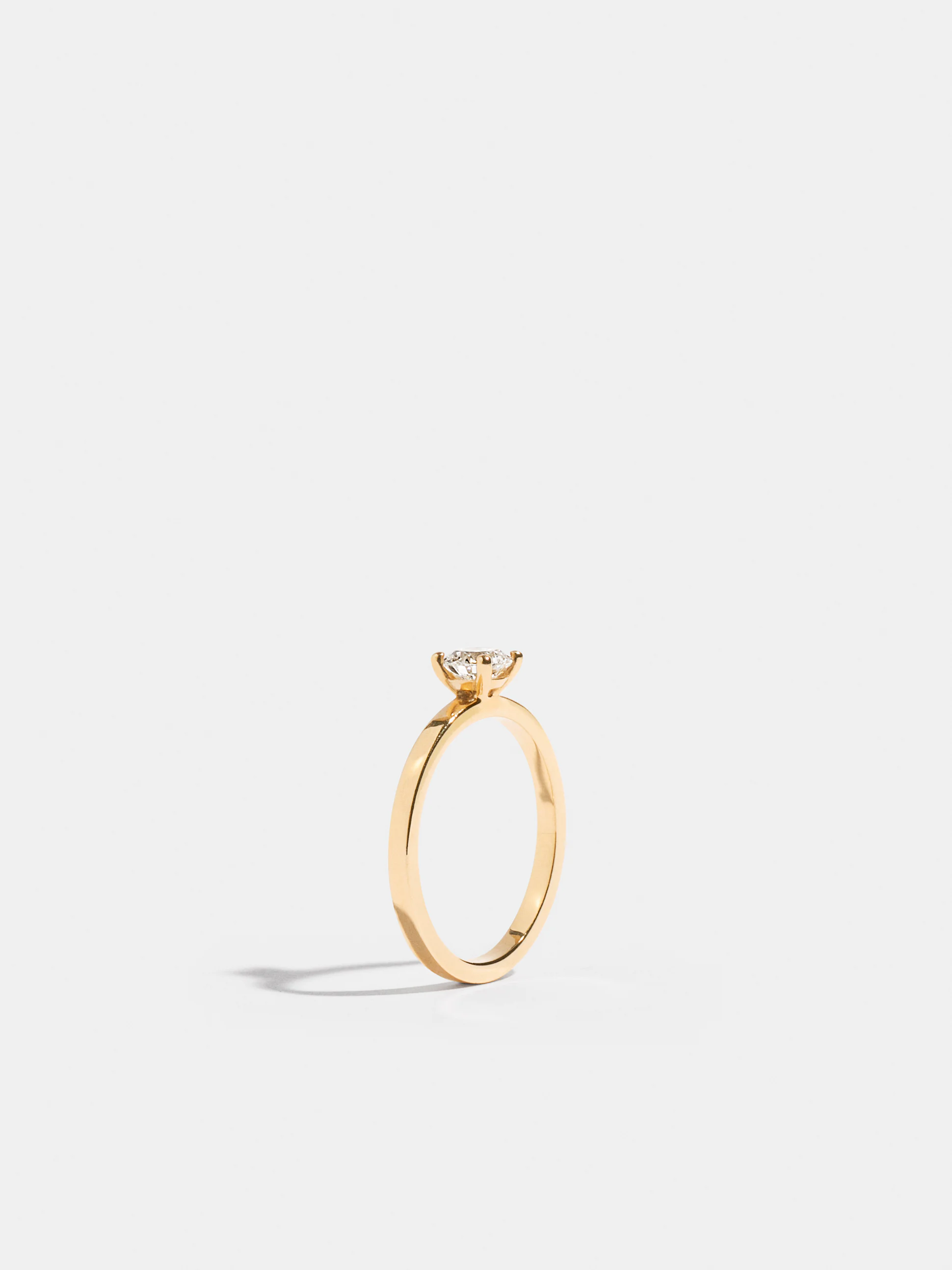 Solitaire With Ribbon Anagramme flat ribbon Solitaire in yellow gold Fairmined ethical set ...