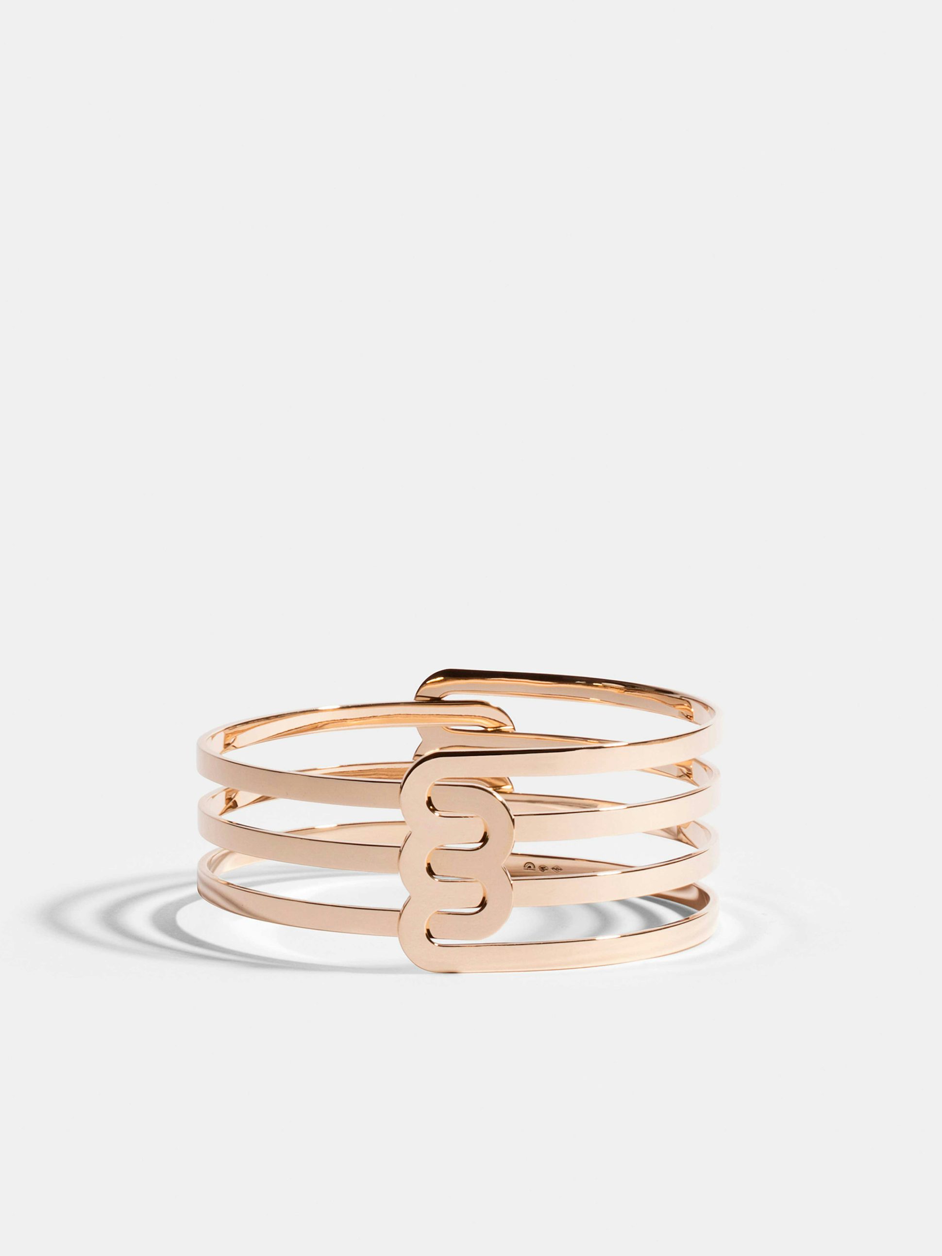 Bracelet Étreintes en Or rose éthique 18 carats certifié Fairmined composé d'un demi-bracelet double finition poli-brillant et d'un demi-bracelet triple finition poli-brillant.