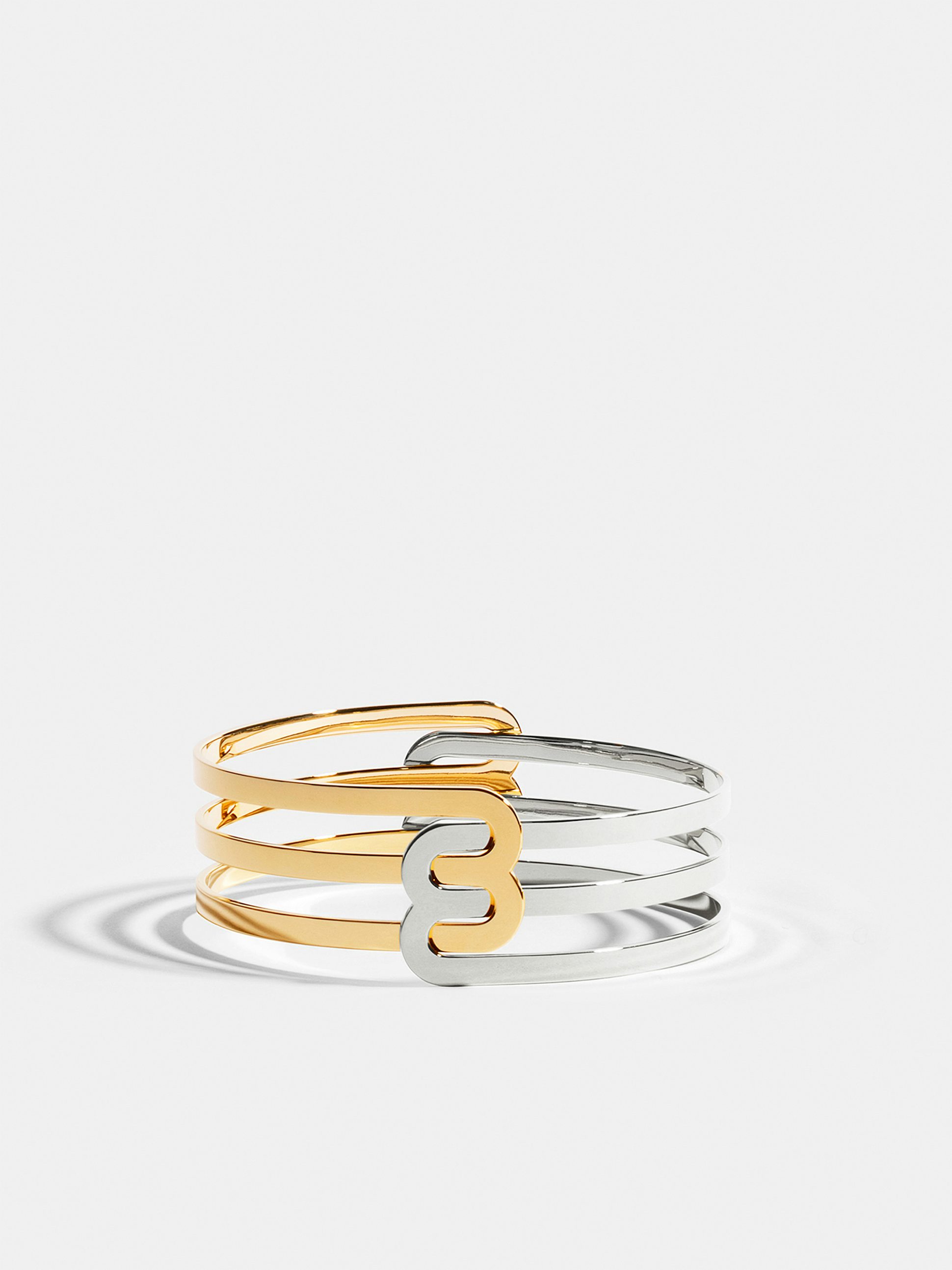 Bracelet Étreintes en Or jaune et blanc éthique 18 carats certifié Fairmined composé de deux demi-bracelets doubles finition poli-brillant.
