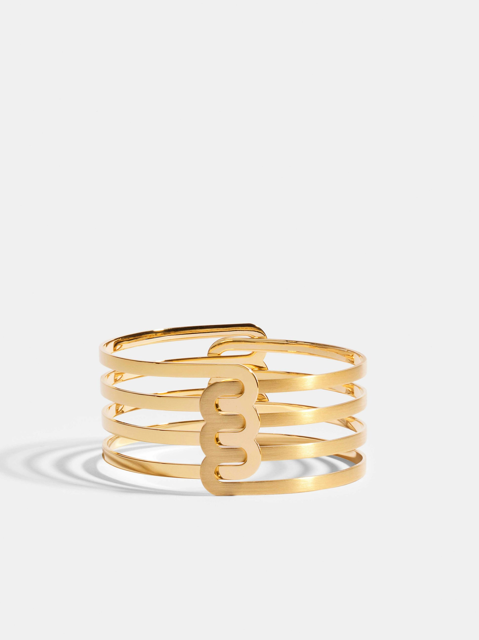 Bracelet Étreintes en Or jaune éthique 18 carats certifié Fairmined composé d'un demi-bracelet triple finition poli-brillant et d'un demi-bracelet triple finition brossée.