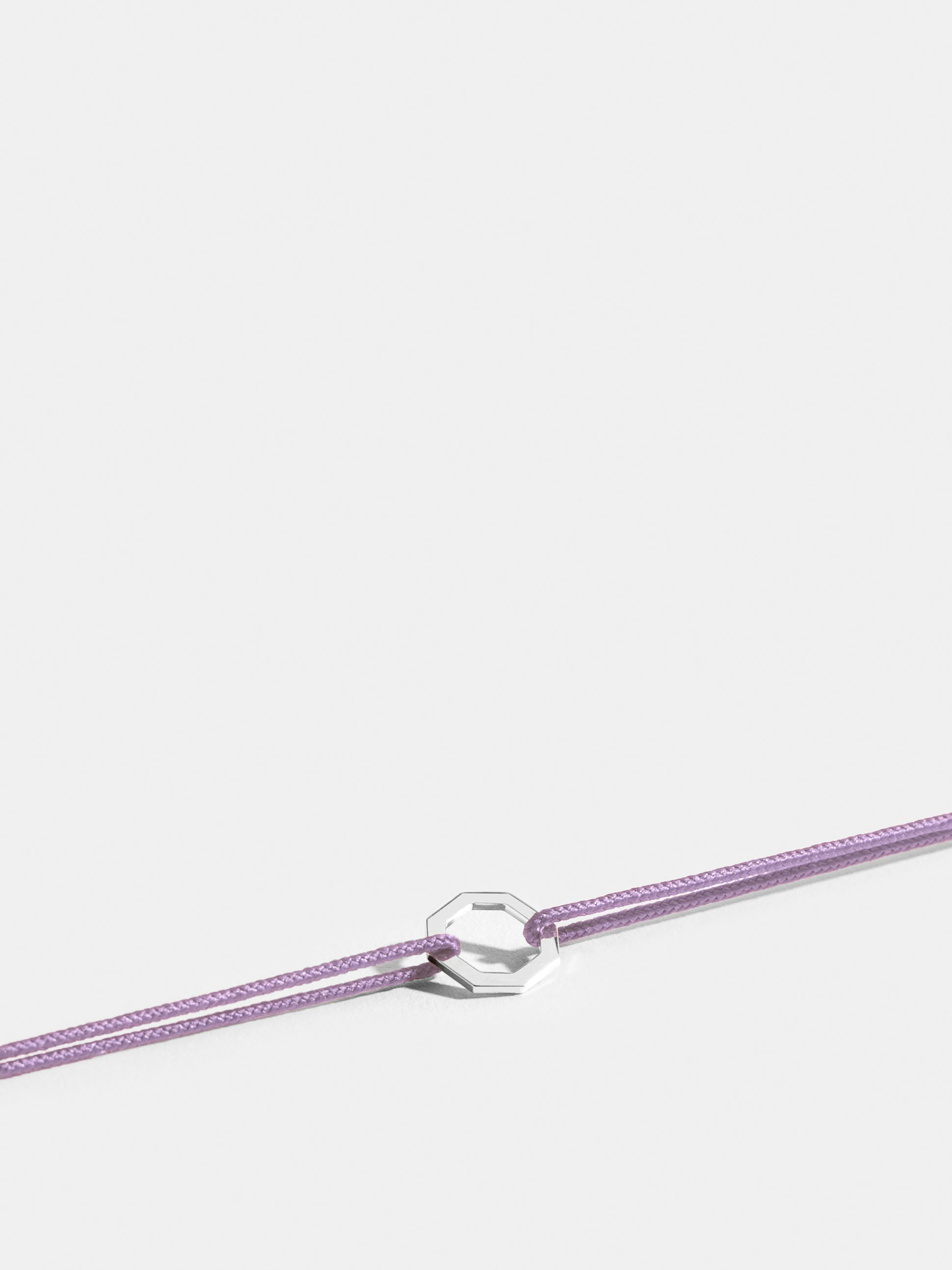Octogone motif in 18k Fairmined ethical rose gold, on an lilac purple cord.