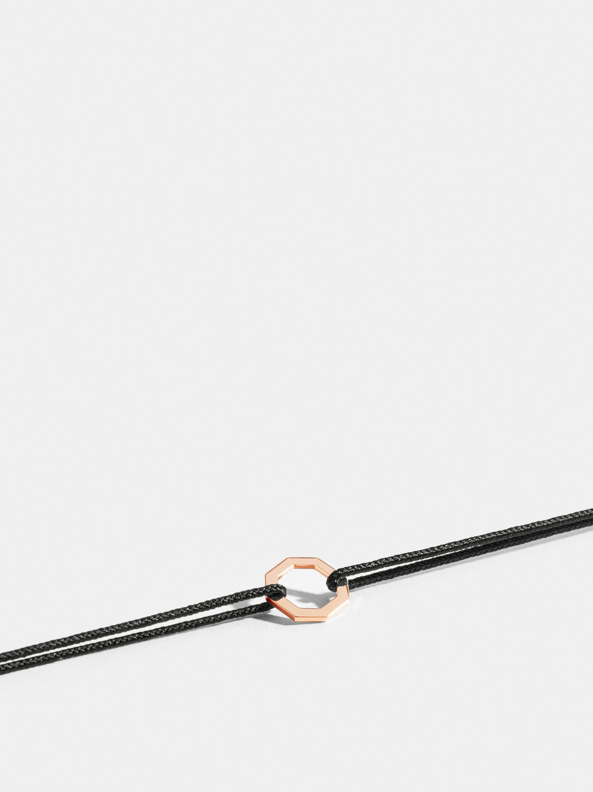 Octogone motif in 18k Fairmined ethical rose gold, on a black cord. 
