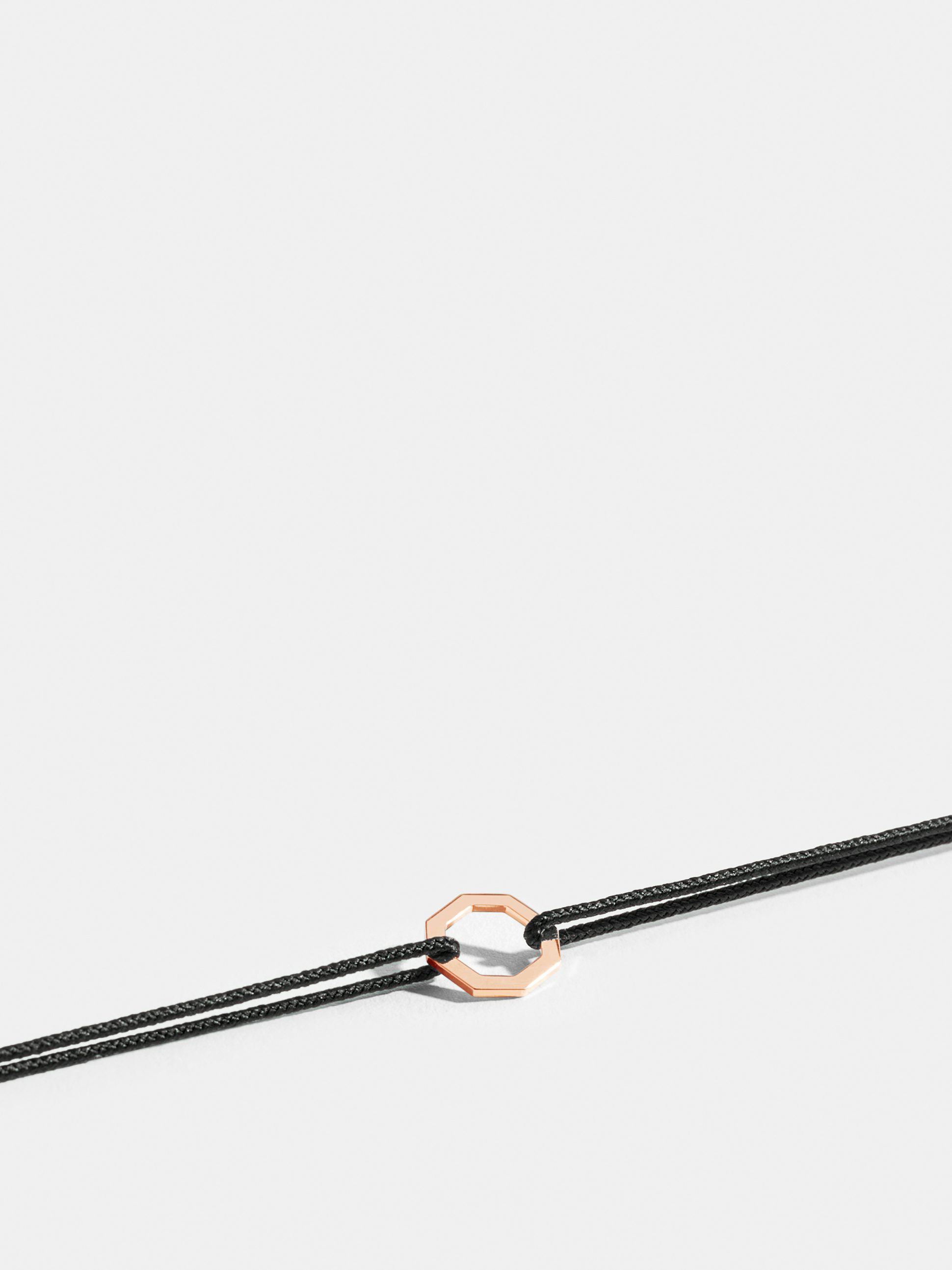 Octogone motif in 18k Fairmined ethical rose gold, on a black cord.