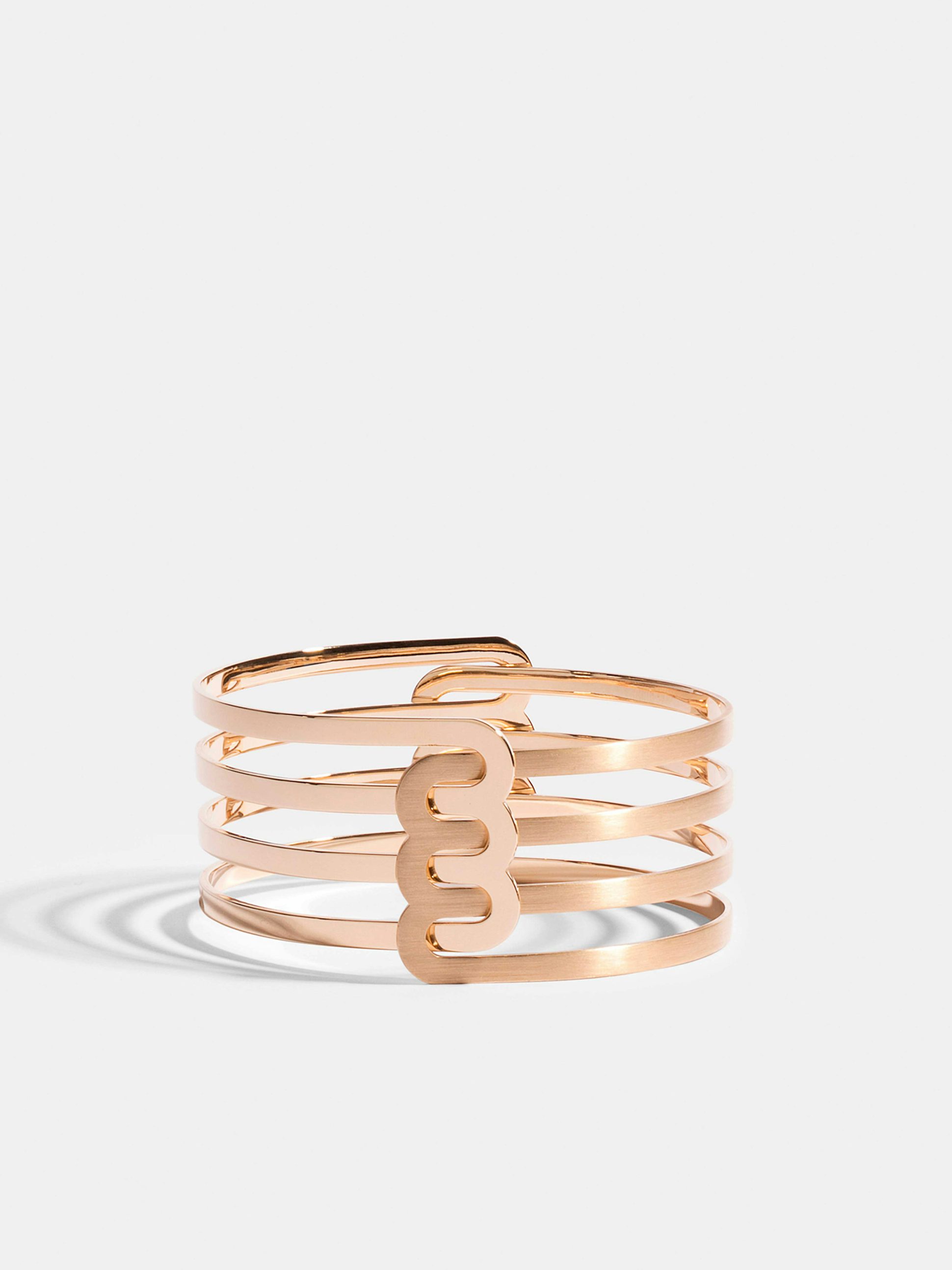 Bracelet Étreintes en Or rose éthique 18 carats certifié Fairmined composé d'un demi-bracelet triple finition poli-brillant et d'un demi-bracelet triple finition brossée.