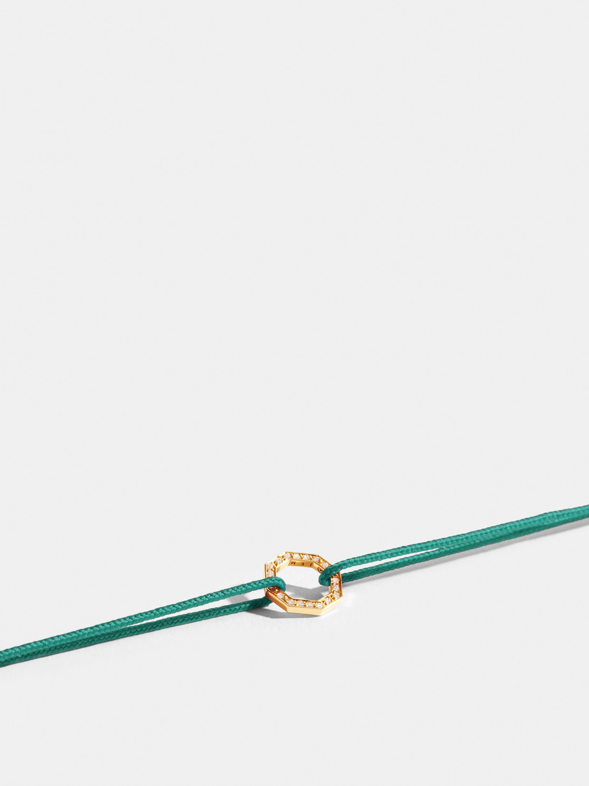 Octogone motif in 18k Fairmined ethical yellow gold, paved with lab-grown diamonds, on a turquoise blue cord.