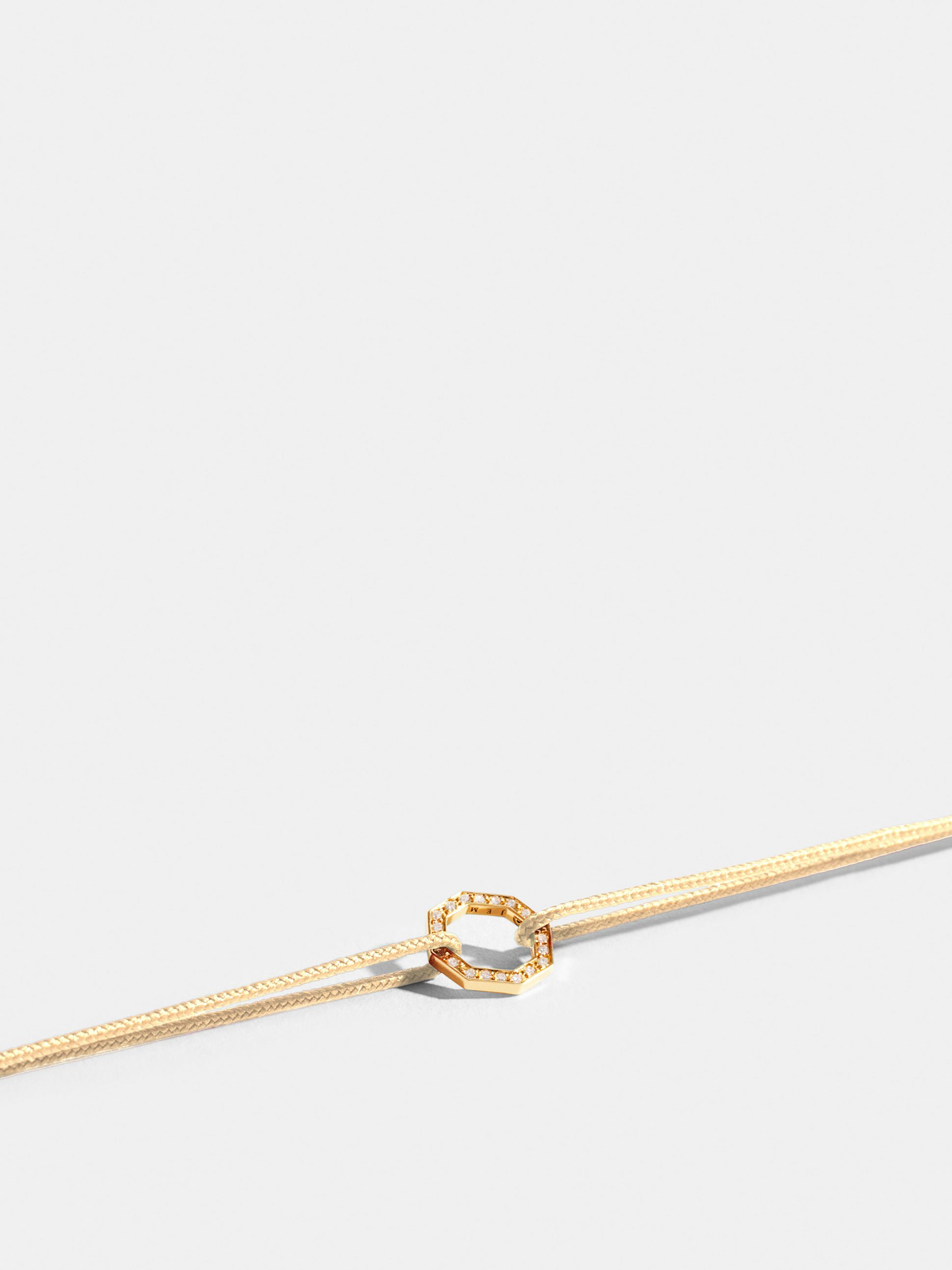 Octogone motif in 18k Fairmined ethical yellow gold, paved with lab-grown diamonds, on an antique ivory white.