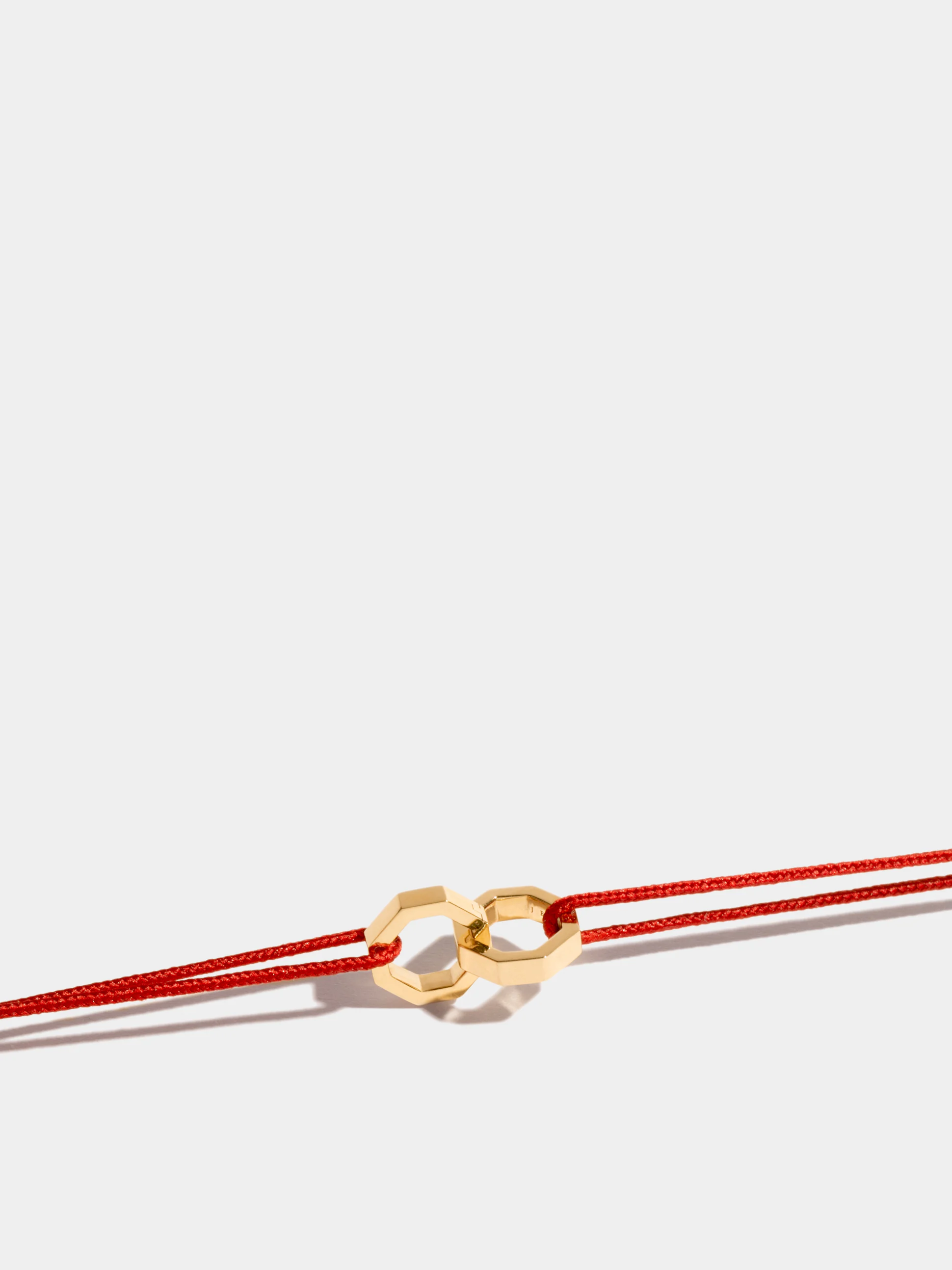 Double Octogone motif in 18k Fairmined ethical yellow gold, on a cord.