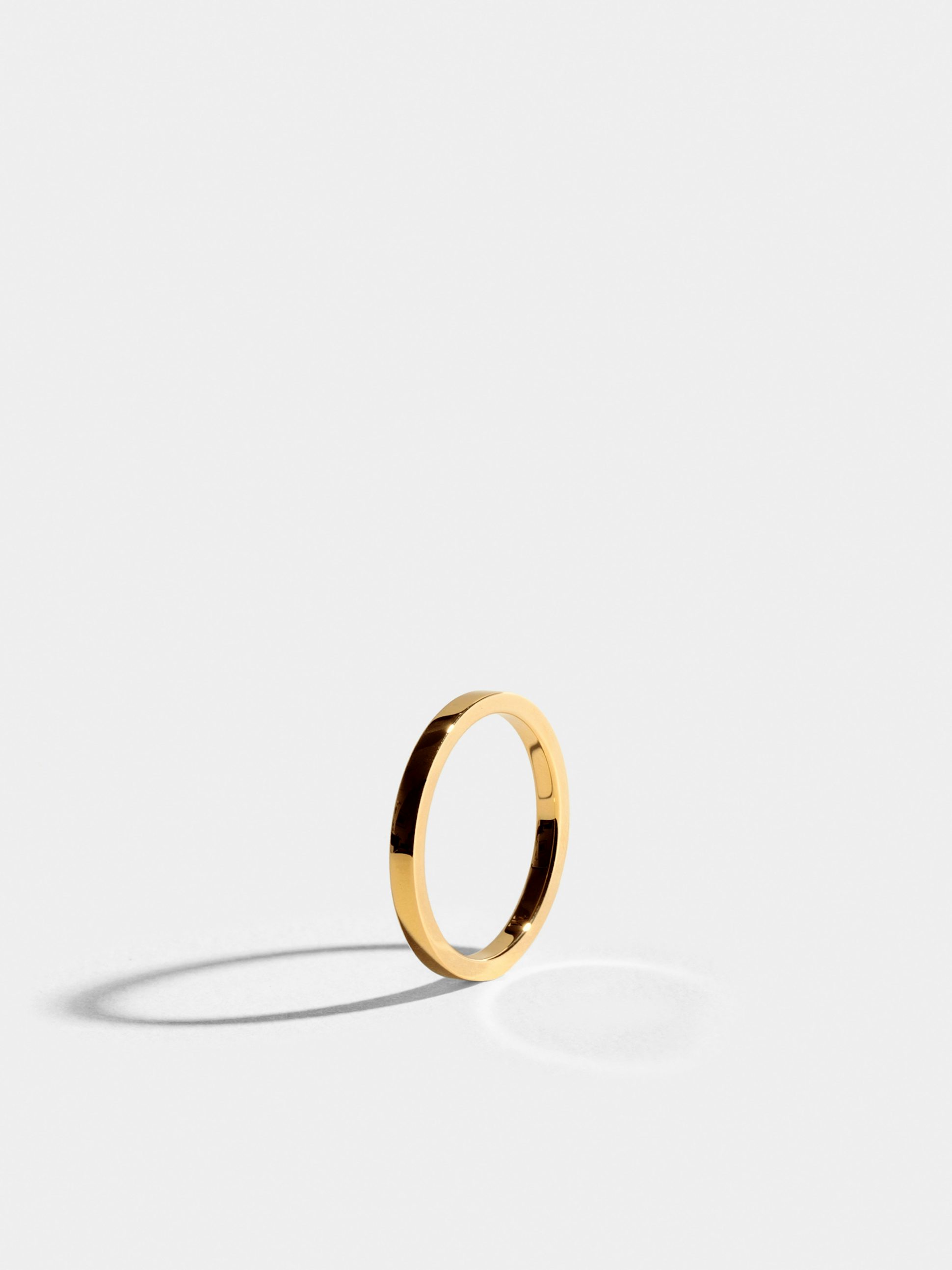 Anagramme flat ribbon ring in 18k Fairmined ethical yellow gold